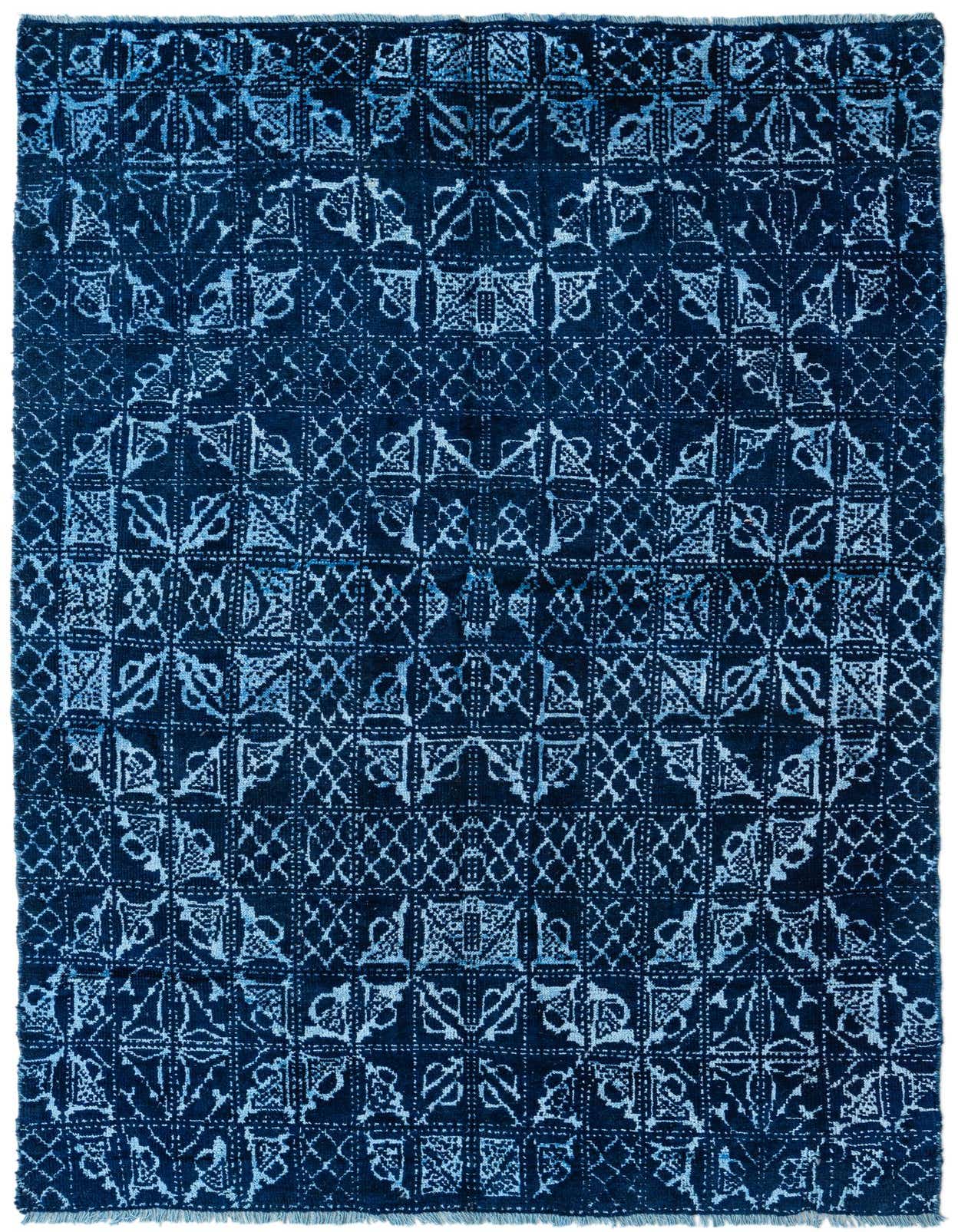 A 5x8 rectangular Darya rug with a modern abstract pattern in varying shades of blue, suitable for a living room.