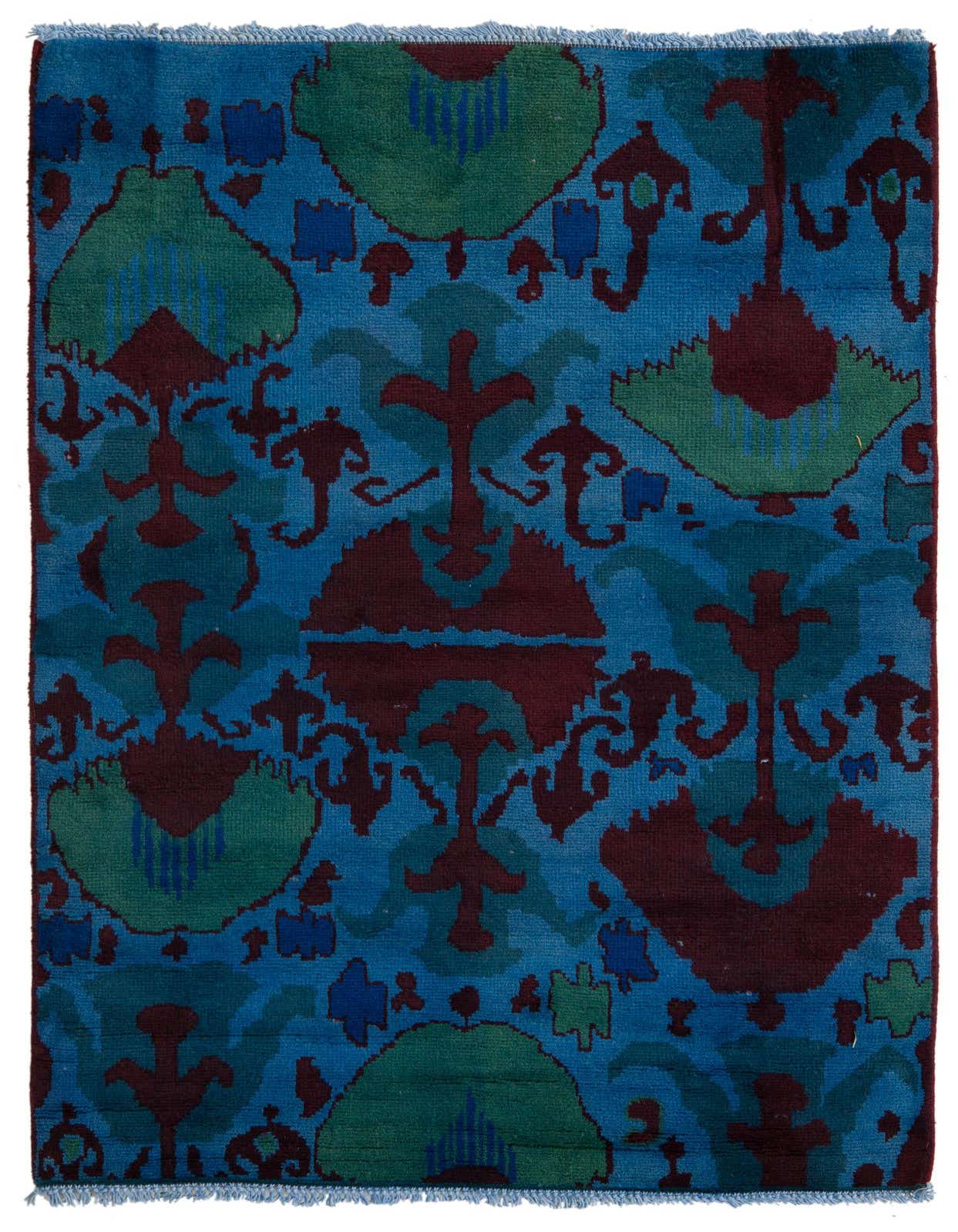 A 4x6 rectangular Darya rug with a high pile, featuring an abstract oriental pattern in various shades of blue, green, and burgundy.