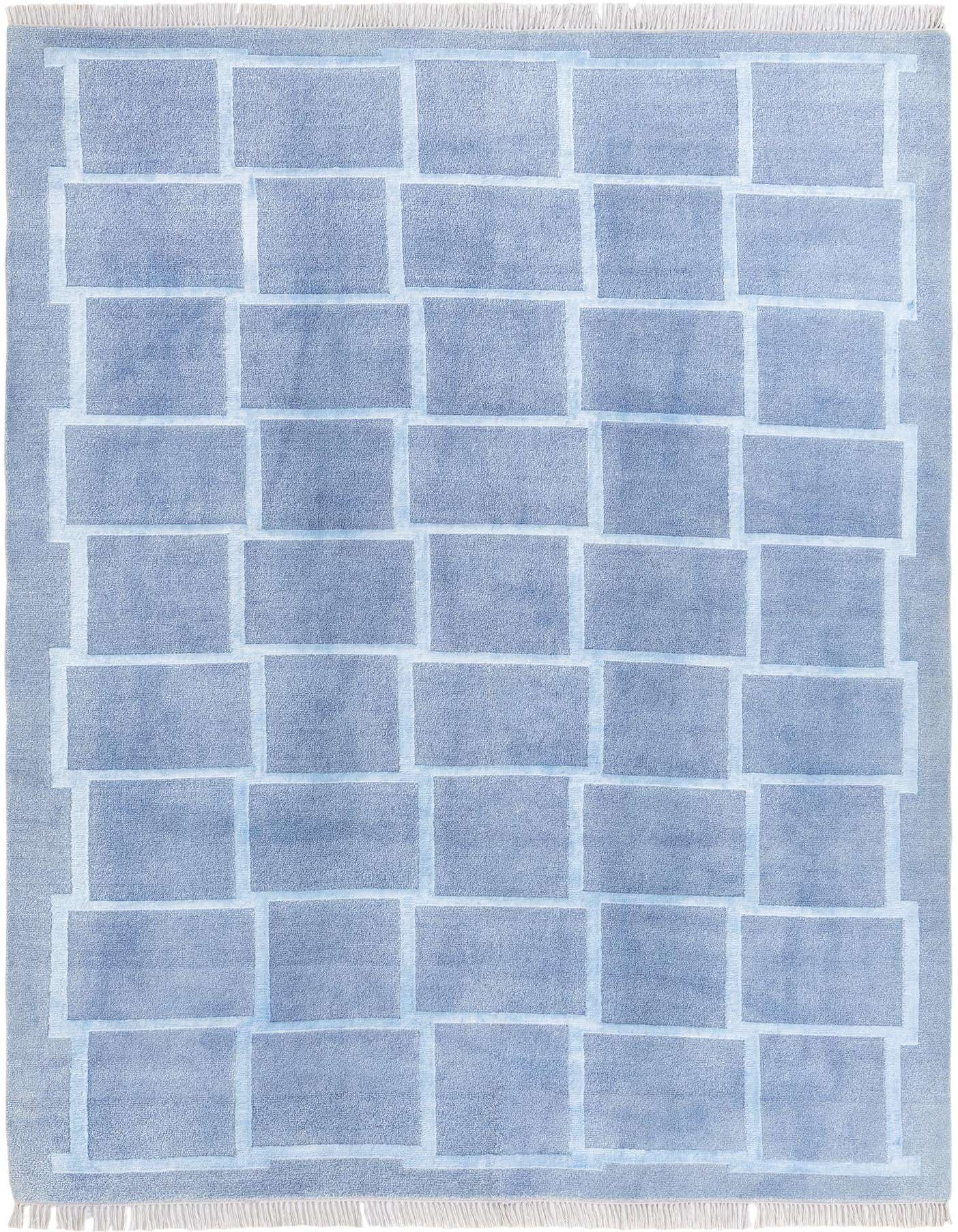 A 5x8 rectangular Darya rug in varying shades of blue, featuring a modern geometric pattern of interlocking rectangles, made from 100% wool with a high pile.