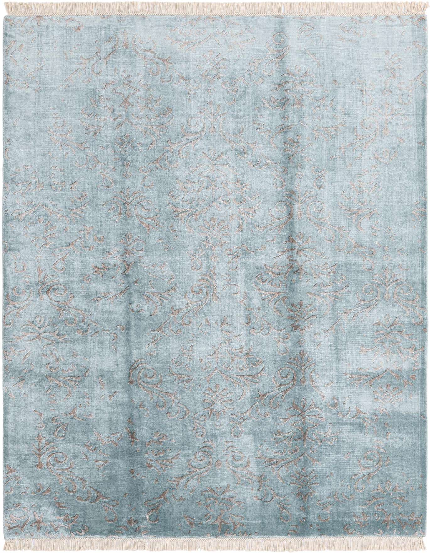 A 5x8 rectangular Darya rug in varying shades of blue with a subtle, distressed modern pattern and fringed ends.