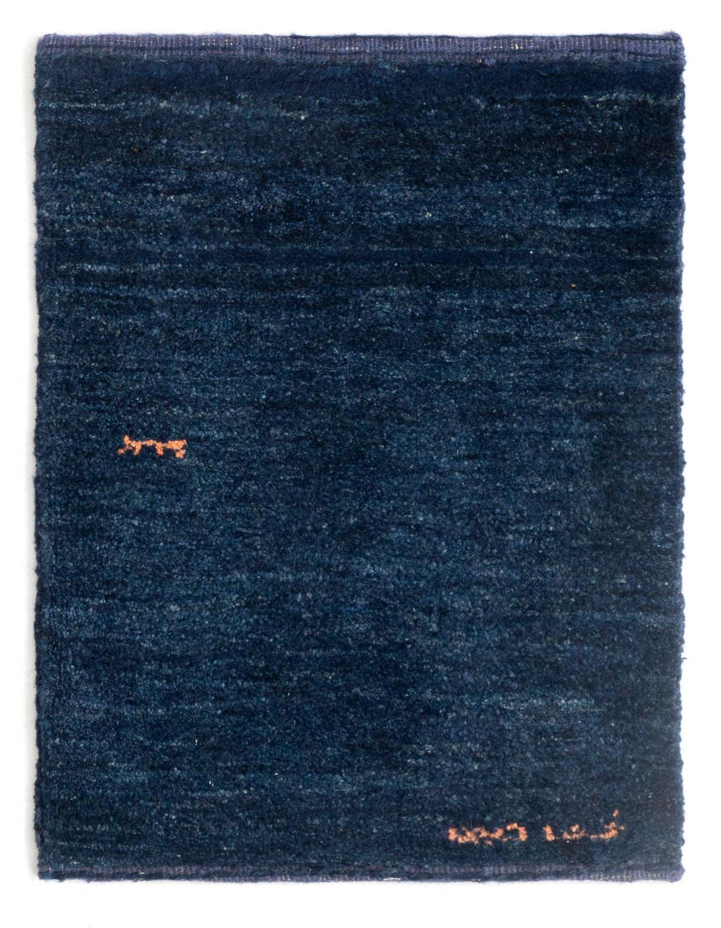 A 1x2 rectangular Gabbeh Shouli rug in deep blue wool with subtle texture and small orange accents.
