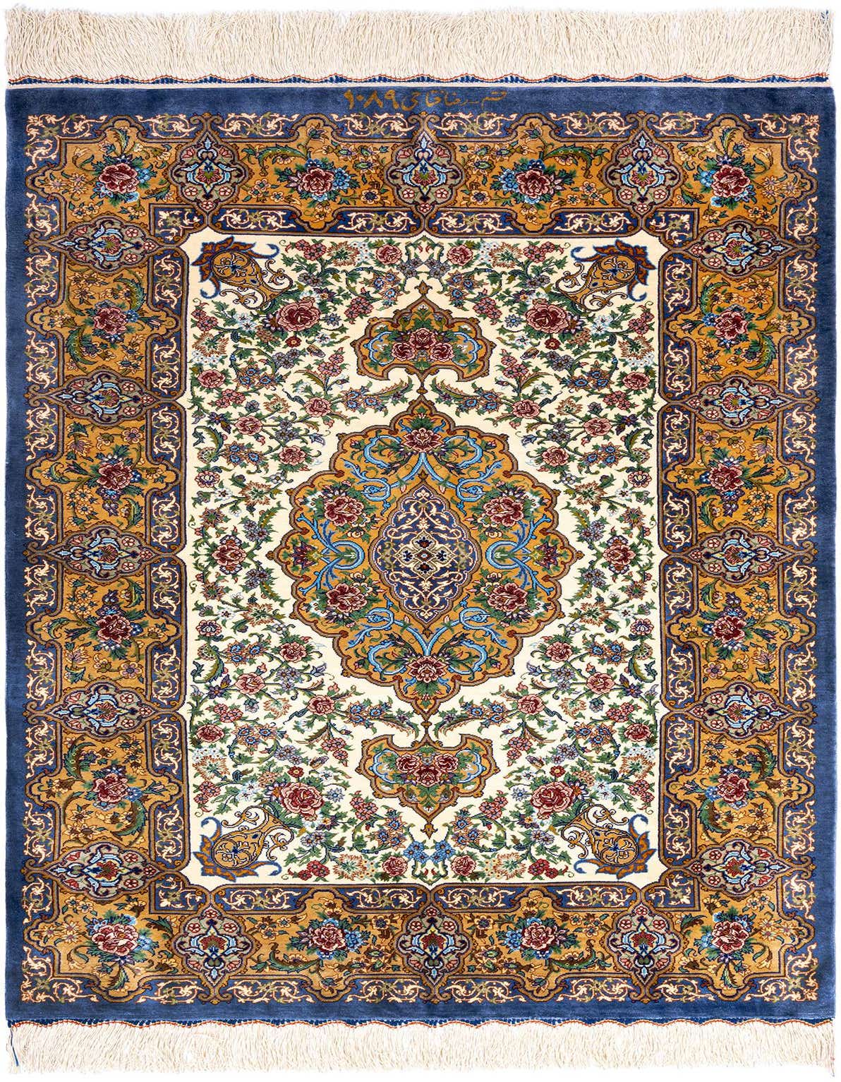 A luxurious 3x4 rectangular Ghom Silk rug with a detailed Persian floral pattern in blues, gold, and red on a cream background, featuring a central medallion and ornate border.