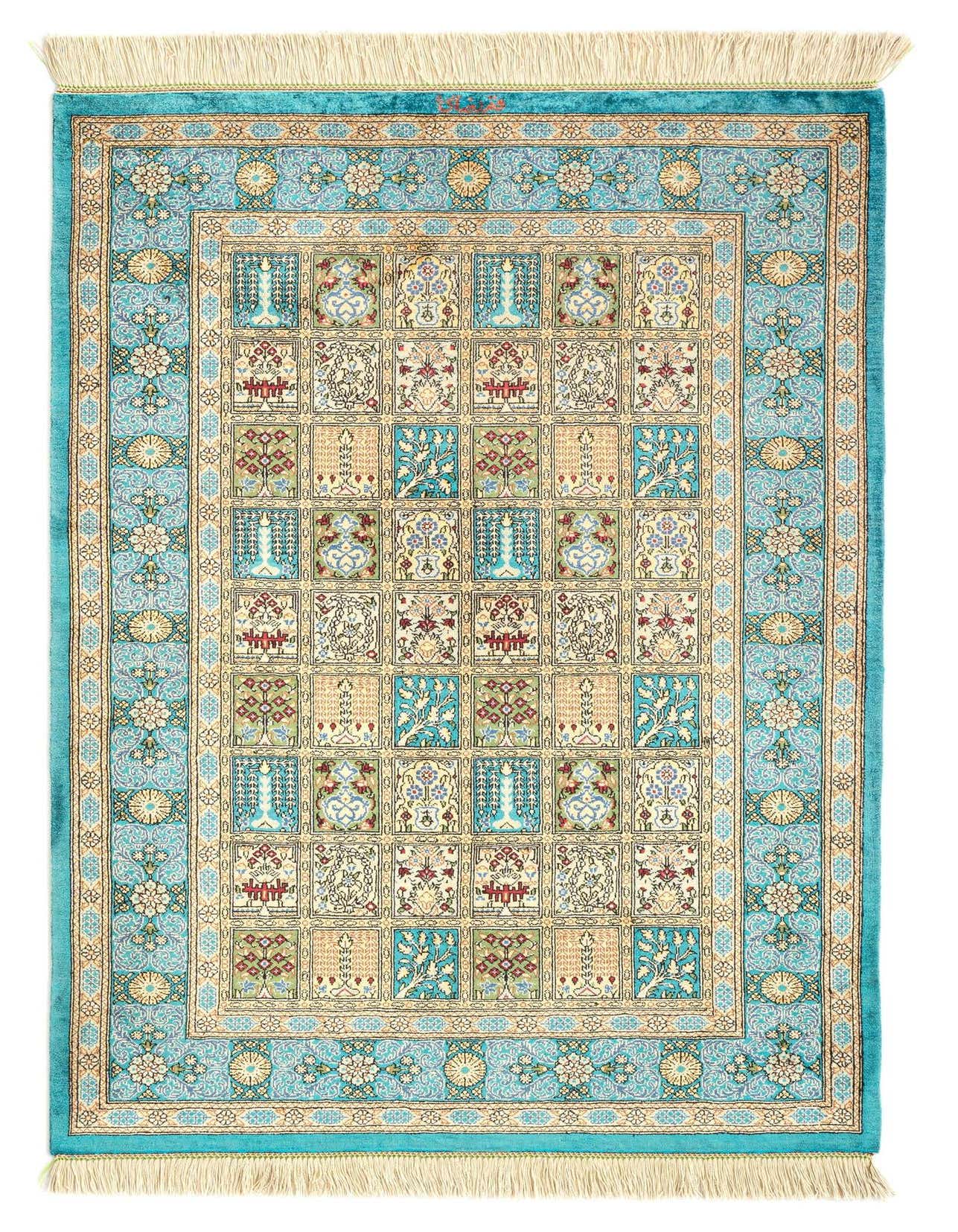 A 3x4 rectangular Ghom Silk Persian rug featuring a grid of intricate floral and botanical motifs in various shades of blue, cream, and subtle greens, framed by a wide blue border with traditional patterns and delicate fringes.