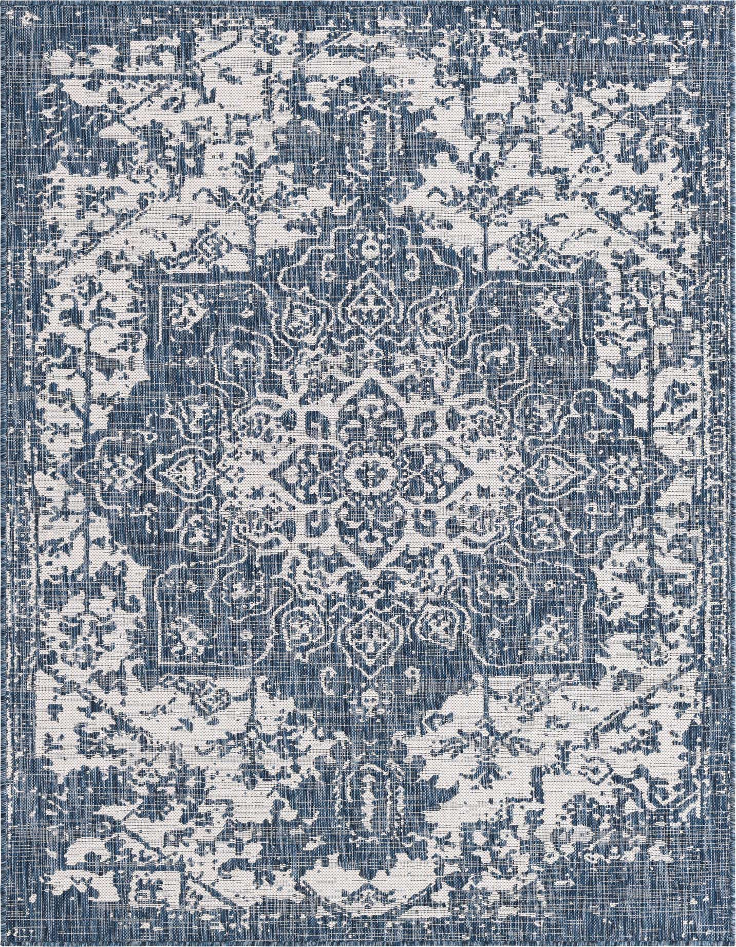 A 5x8 rectangular blue and white indoor/outdoor rug with a distressed Mediterranean medallion pattern.