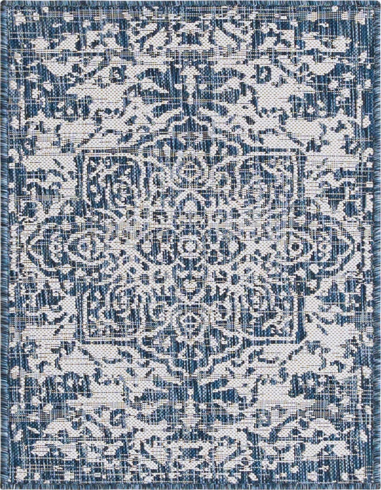 A 2x3 rectangular Jill Zarin Outdoor rug featuring a distressed blue and white Mediterranean medallion pattern, suitable for patios.