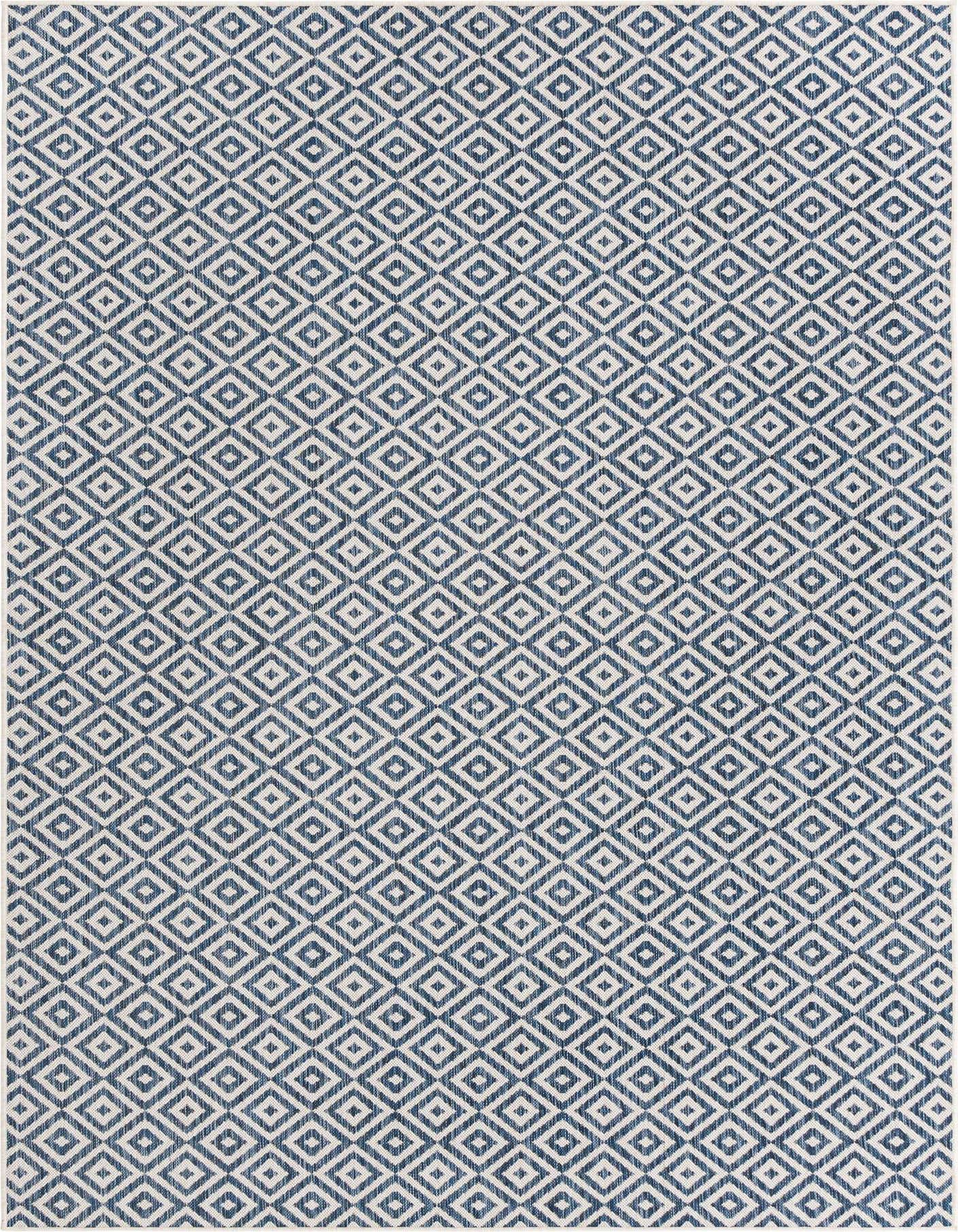 A 7x10 rectangular Jill Zarin Outdoor rug featuring a repeating blue and white geometric trellis pattern, suitable for indoor or outdoor spaces.