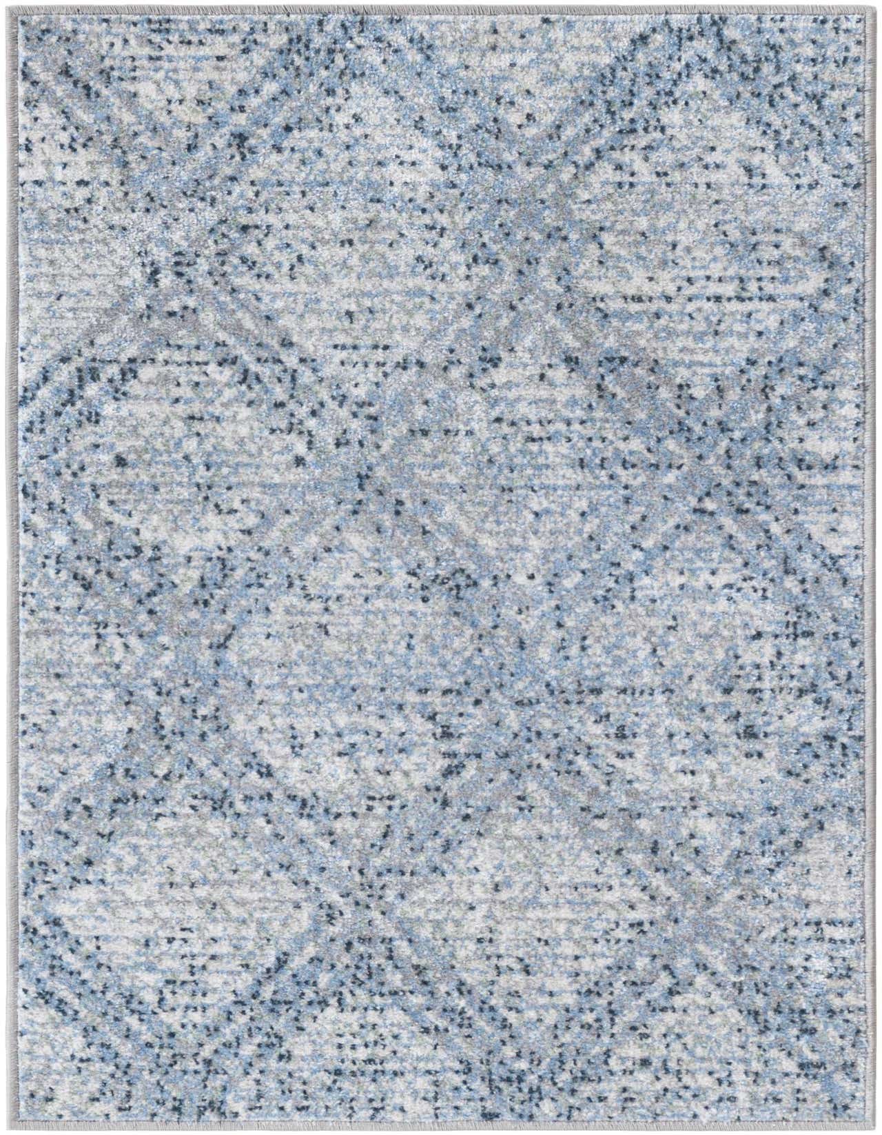 A 2x3 rectangular Kamala Washable rug featuring an abstract pattern in varying shades of blue, gray, and white.