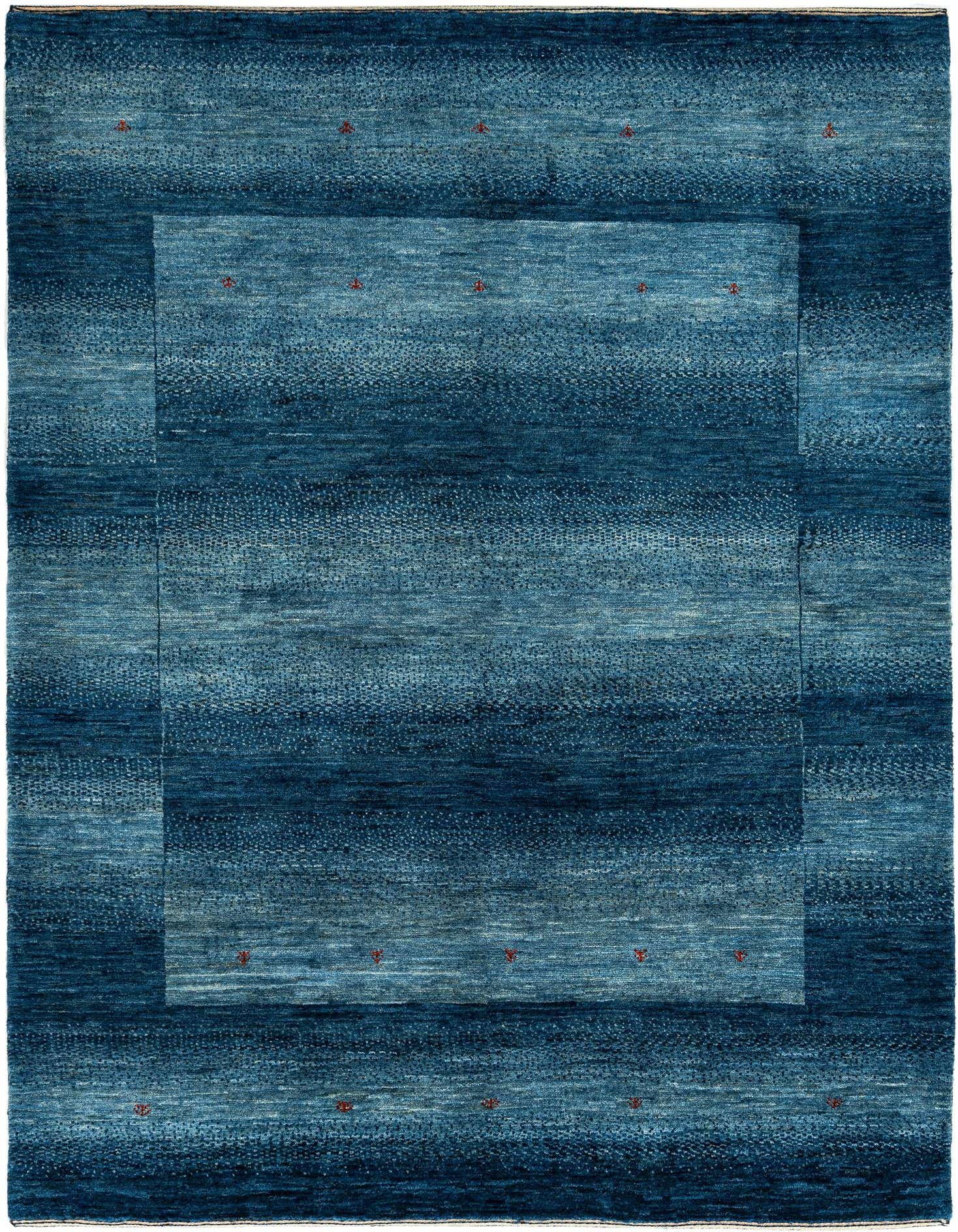 A rectangular, handmade Kashkuli Persian wool rug in varying shades of blue, featuring a subtle border and small red accents.