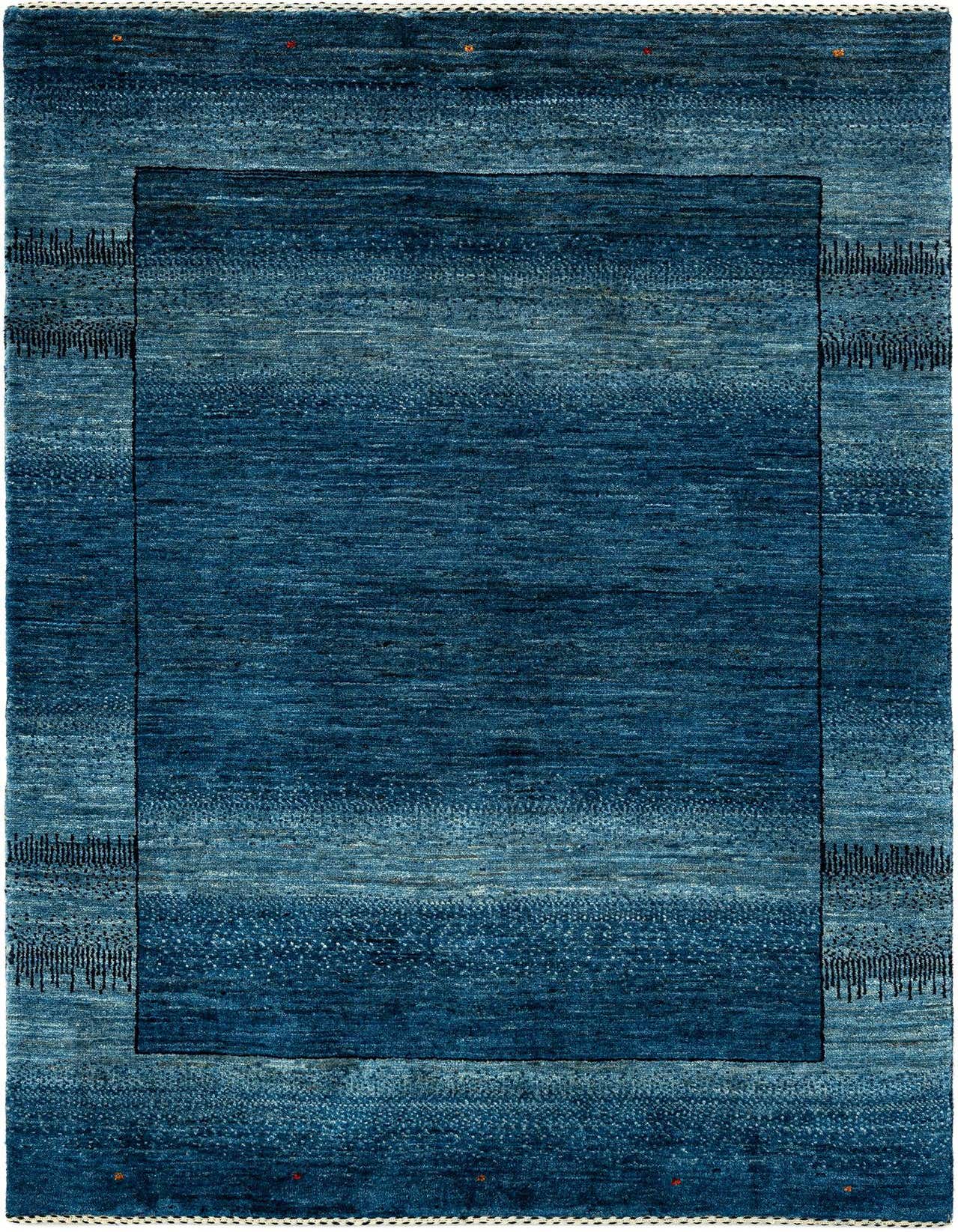 A rectangular Kashkuli Persian wool rug in varying shades of blue, featuring a solid dark blue center and lighter blue border with subtle textured patterns.