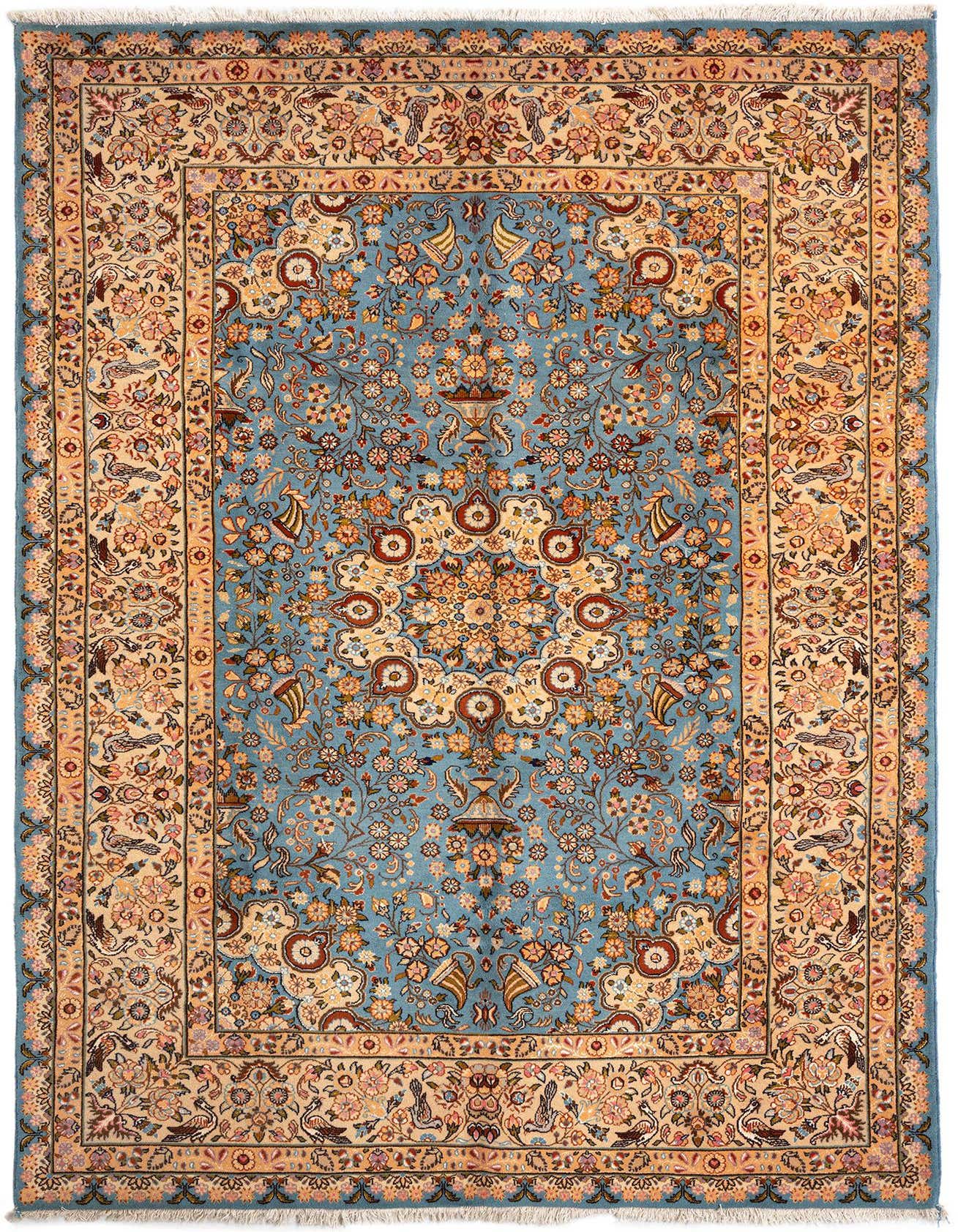 A 6x9 rectangular blue Persian wool rug with an intricate floral and medallion pattern, featuring a cream border with birds and flowers.