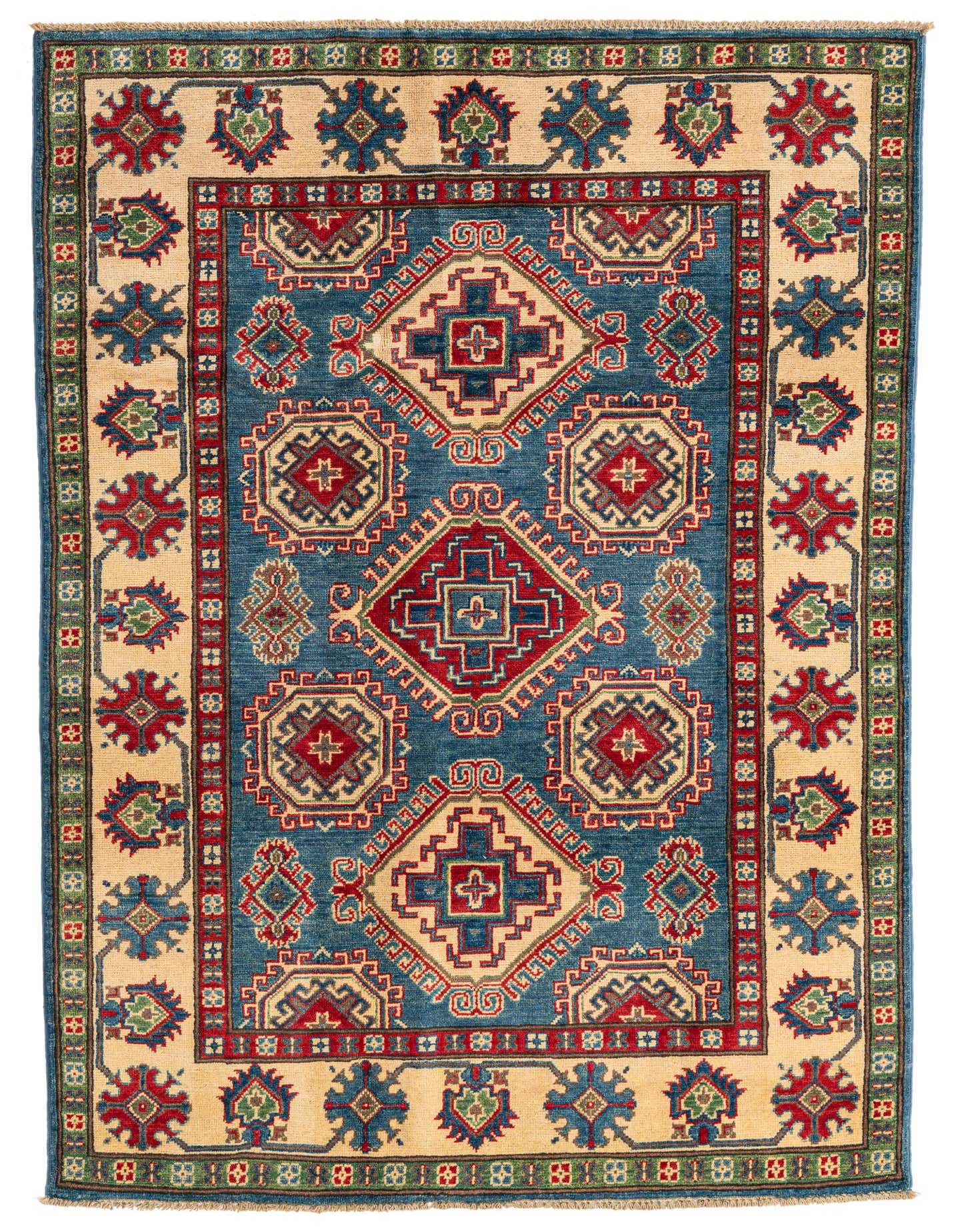 A 4x6 rectangular Kazak rug with a deep blue field and traditional geometric patterns in red, beige, and green.