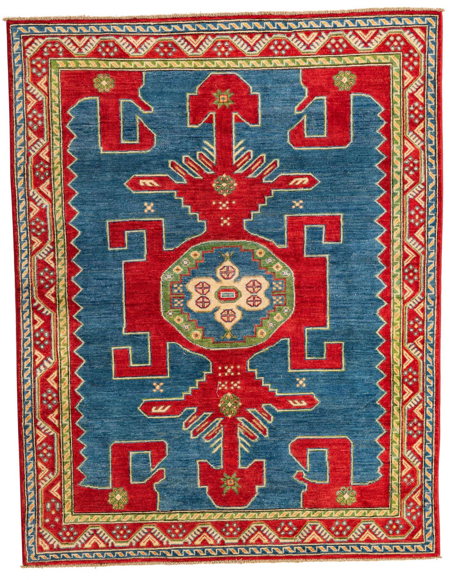 A 5x7 rectangular hand-spun wool rug featuring a bold blue field with a large red medallion and geometric patterns, framed by a multi-colored border.