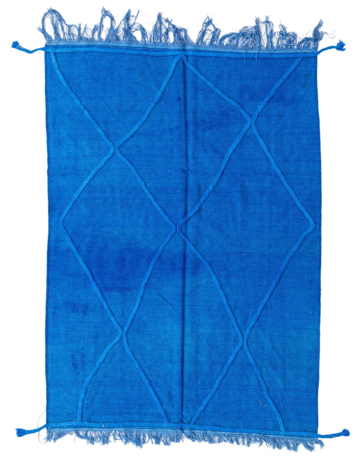 A 4x6 rectangular blue wool rug with a subtle diamond pattern and fringed edges, suitable for various indoor rooms.