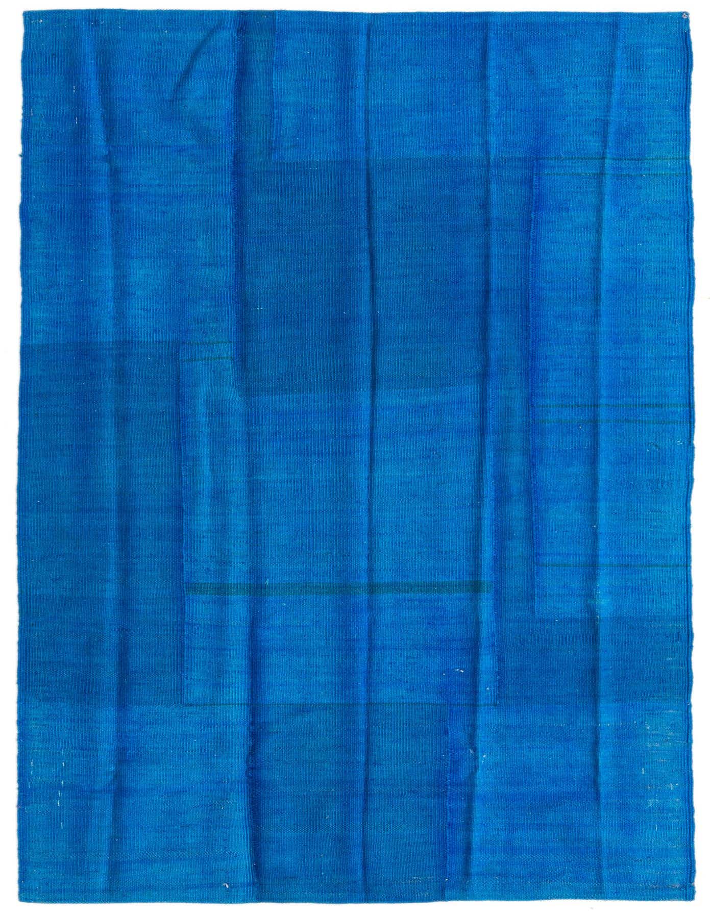 A 4x6 rectangular blue flatweave rug with subtle tonal variations, showcasing a modern tribal pattern.