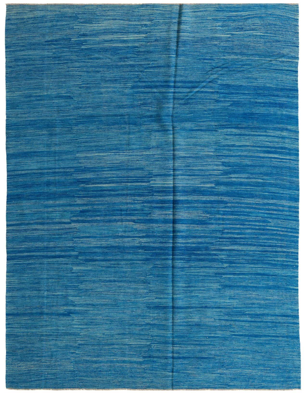 A 7x10 rectangular flatweave rug in varying shades of blue, featuring a subtle abstract tribal pattern.