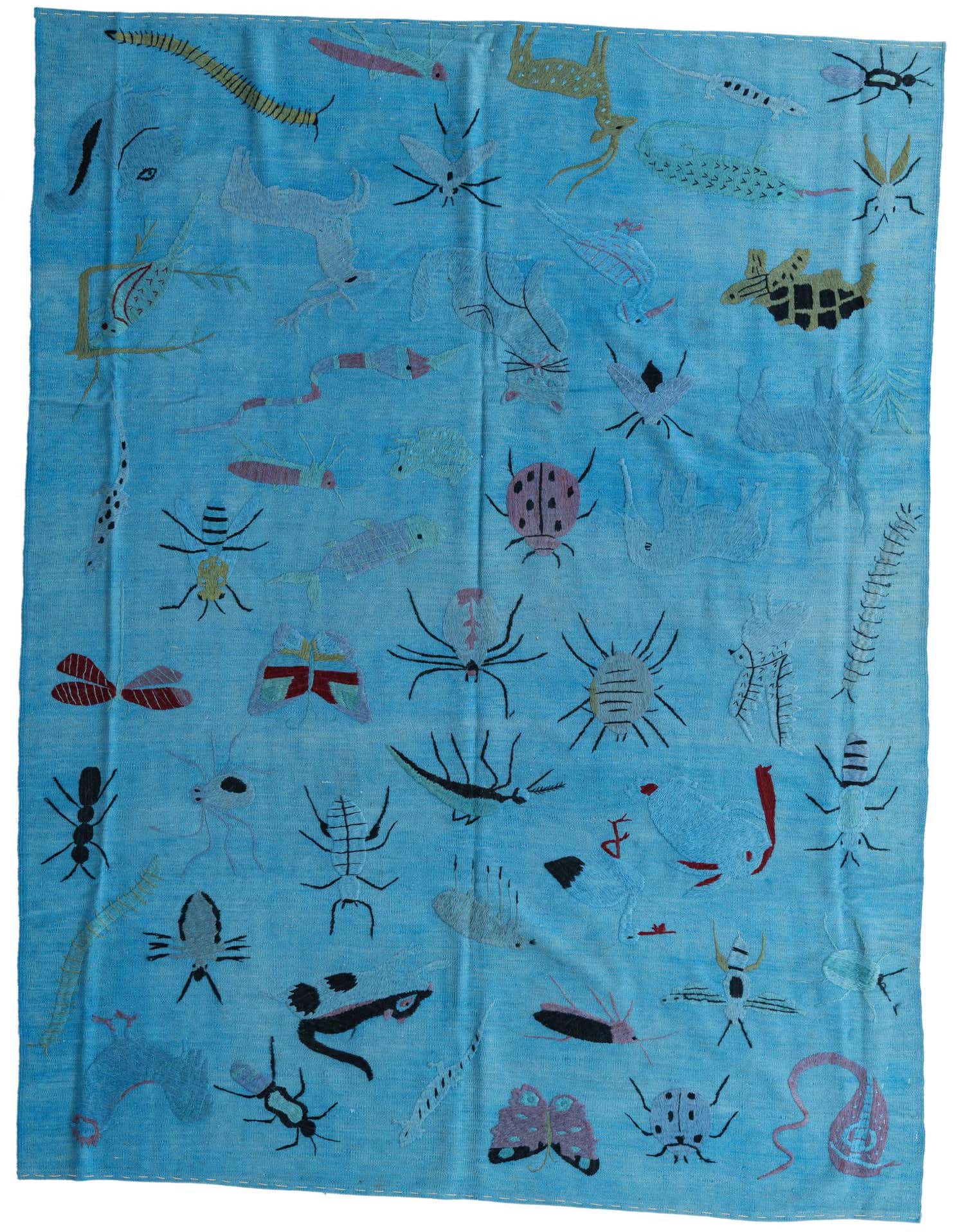 A 6x9 rectangular blue flatweave rug featuring a whimsical array of colorful embroidered insects and animals in a tribal style.