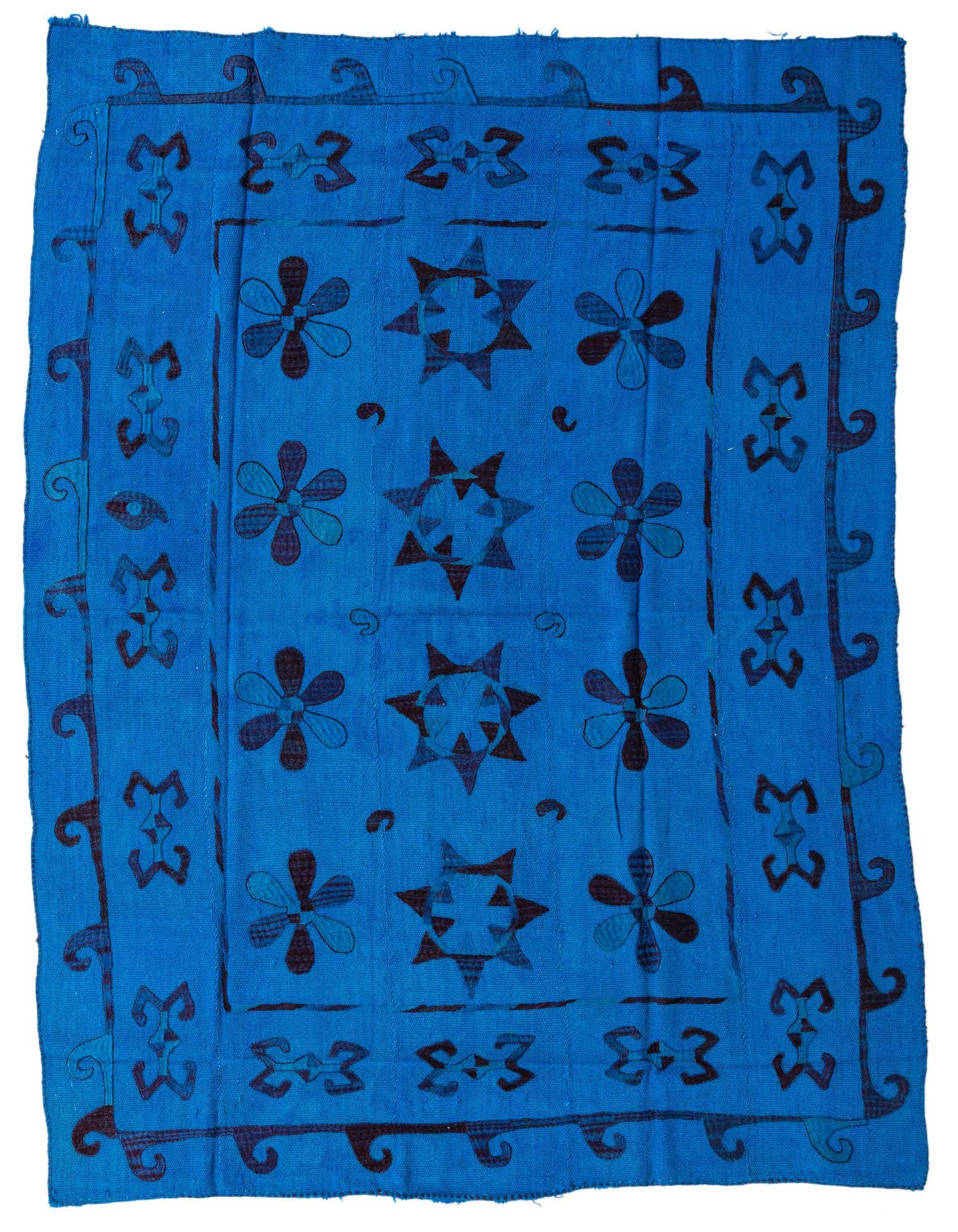 A 5x8 rectangular Kilim Suzani rug featuring a vibrant blue background with dark blue tribal floral and star patterns, and a decorative border.