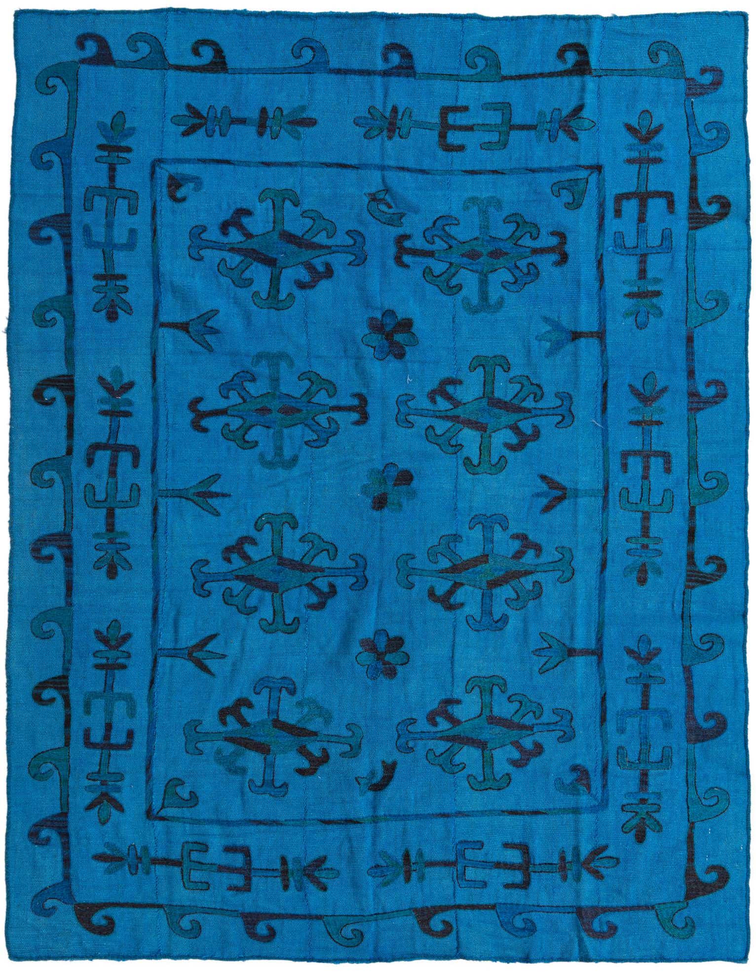 A 5x8 rectangular Kilim Suzani rug in vibrant blues, featuring a tribal, abstract pattern with geometric motifs and a decorative border.