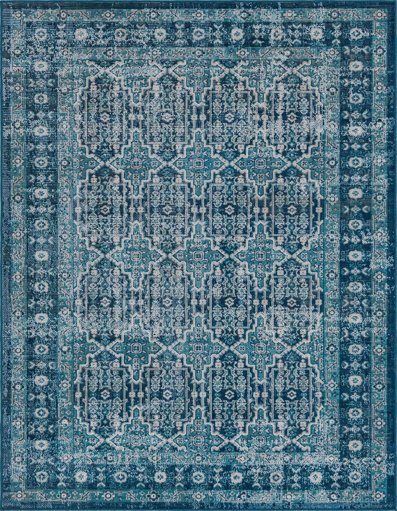 A 5x8 rectangular Lucerne rug in shades of blue with a distressed Bohemian and Traditional pattern, featuring a textured flat pile.