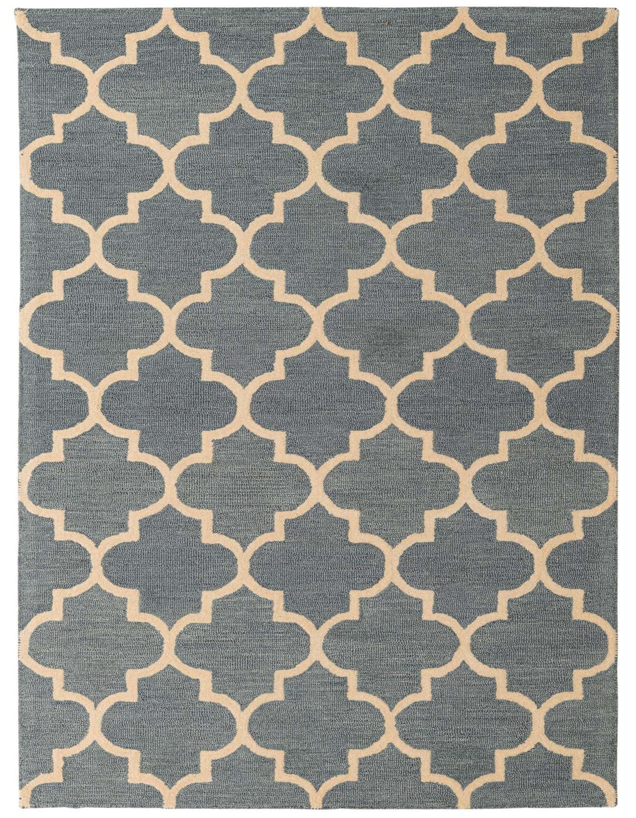 A 5x8 rectangular Luna rug in blue with a cream modern abstract quatrefoil pattern, perfect for a living room.