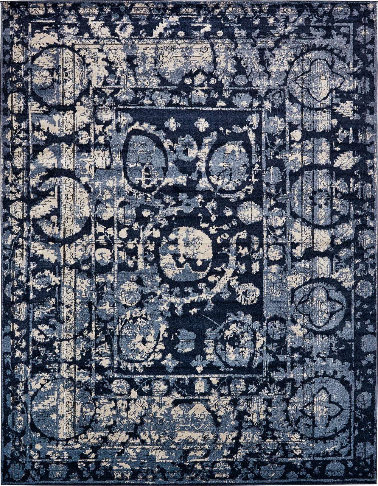 A 10x14 rectangular Rugs.com Miranda area rug featuring a distressed medallion and botanical pattern in various shades of blue and cream.