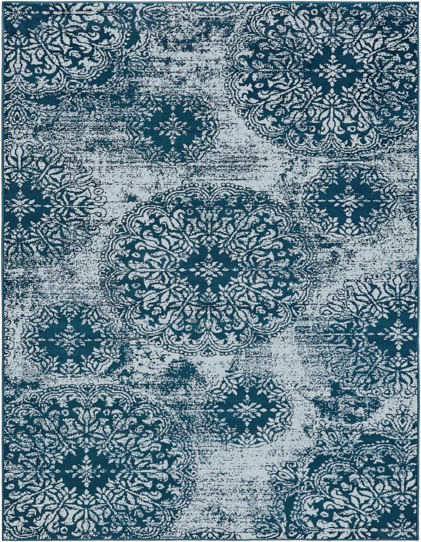 A 6x9 rectangular Monte Carlo rug featuring an ornate blue and white medallion pattern with a distressed, vintage look.