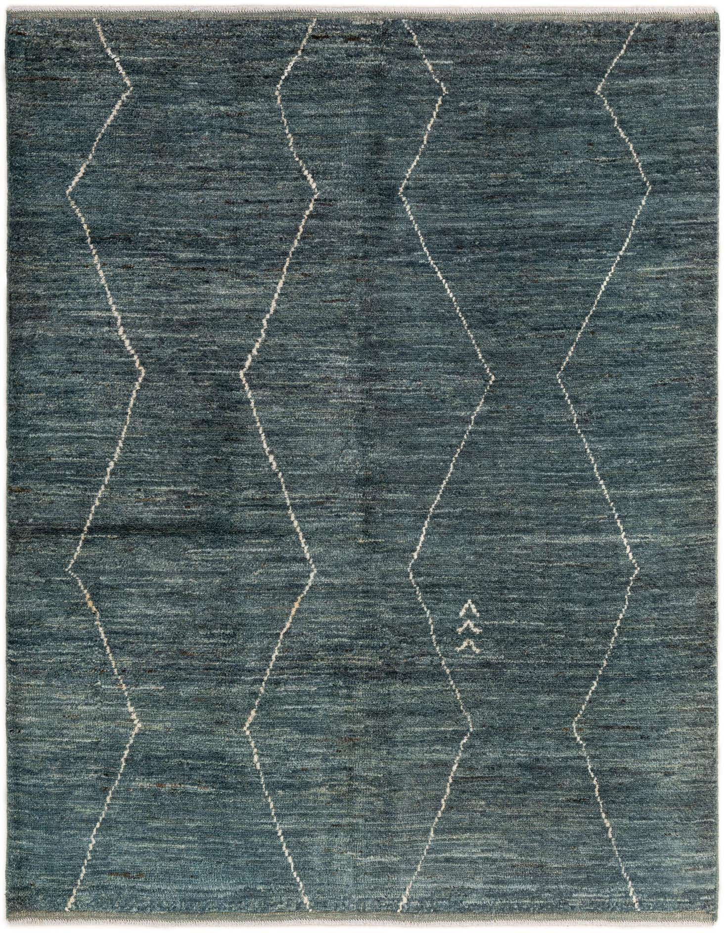 A 4x6 rectangular Moroccan rug in varying shades of blue with a white tribal diamond pattern.