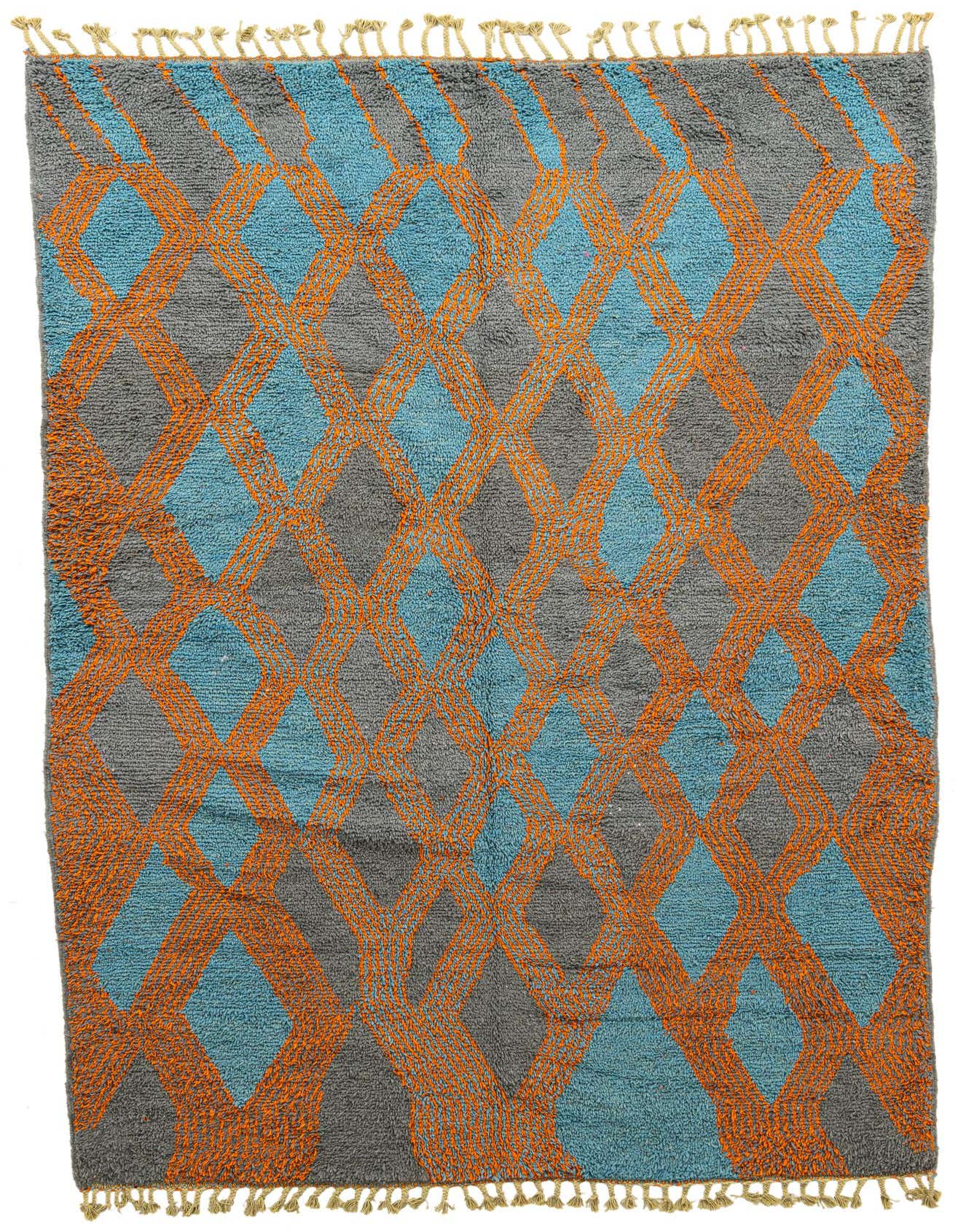 A 7x10 rectangular Moroccan shag rug featuring a tribal diamond pattern in blue and orange on a gray background, with fringed edges.