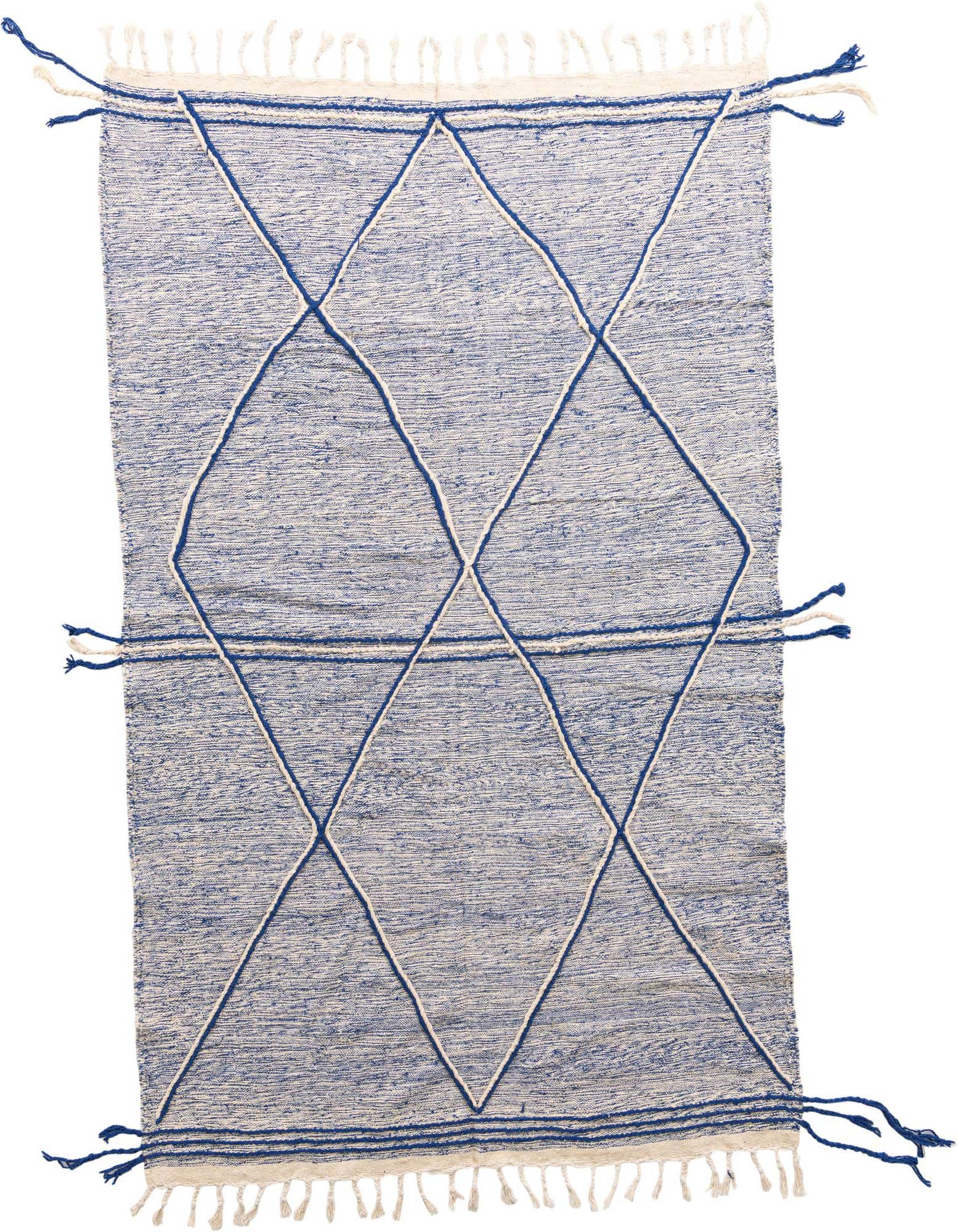 A 6x9 rectangular blue wool shag rug with a white tribal diamond pattern and white fringe.