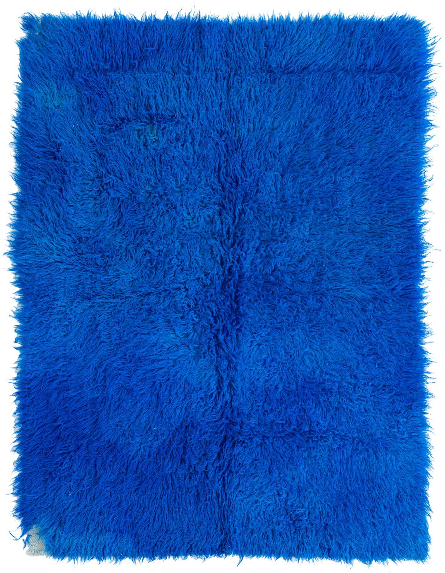 A vibrant 4x6 rectangular blue shag rug with a thick, plush pile, perfect for a modern living room.