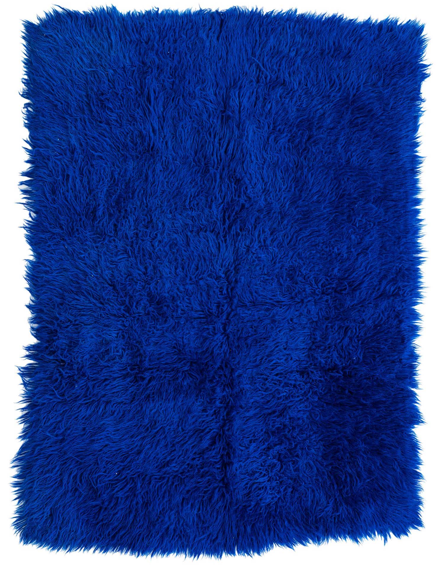 A vibrant 4x6 rectangular Moroccan shag rug in a deep blue hue, handmade from wool.