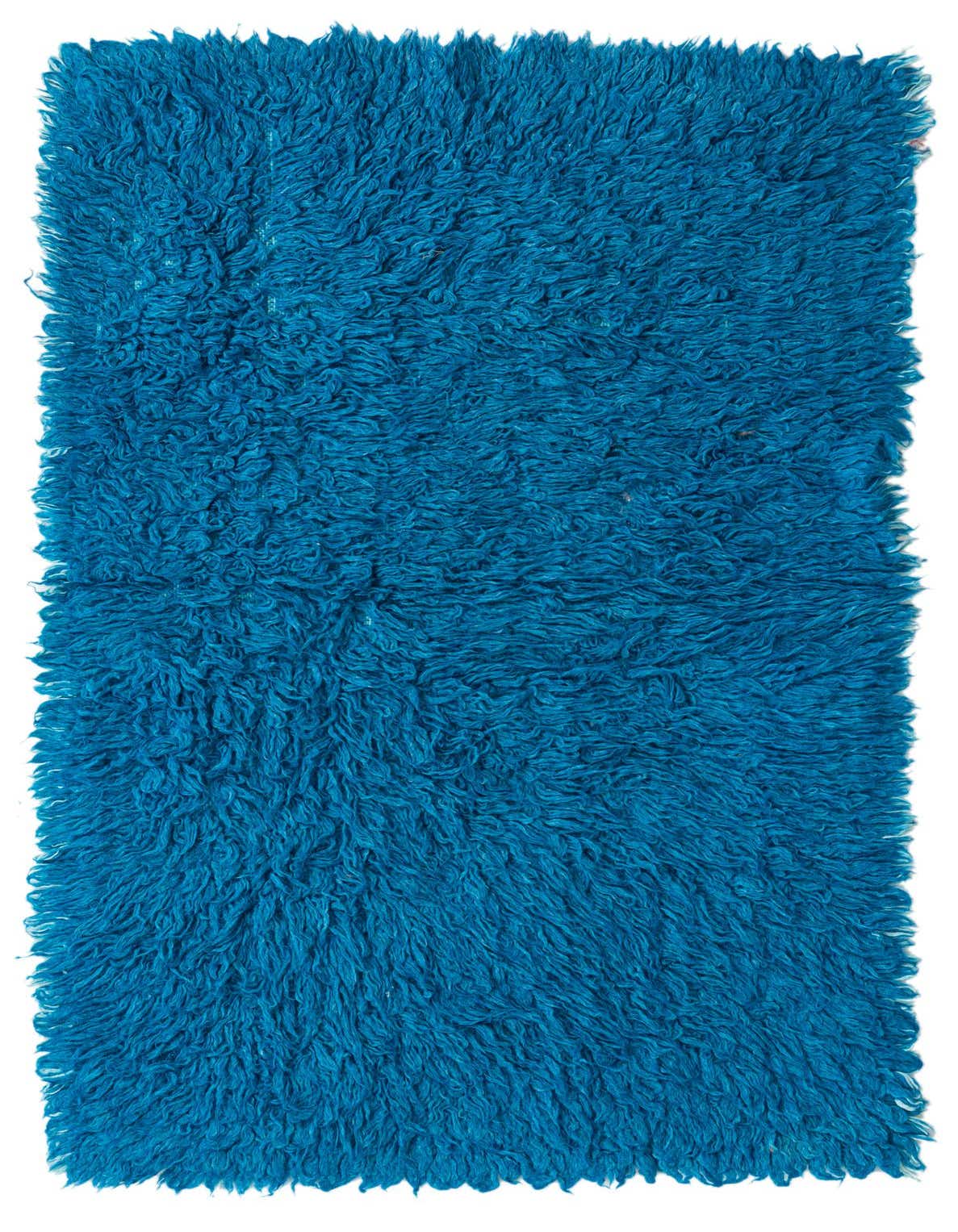 A vibrant 3x5 rectangular shag rug in a rich blue hue, handmade from wool, perfect for adding texture.