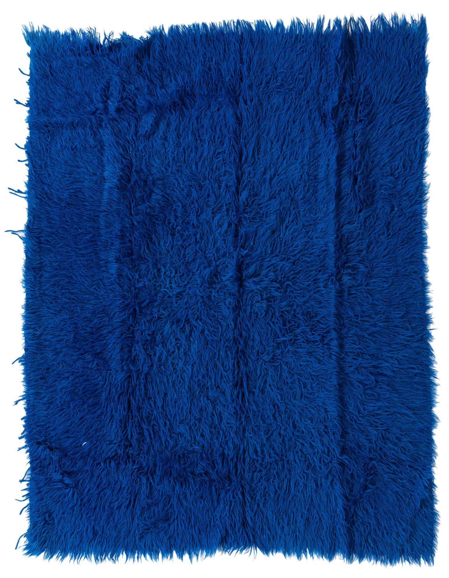A vibrant 4x6 rectangular blue shag rug with a thick, plush pile, ideal for a living room or bedroom.