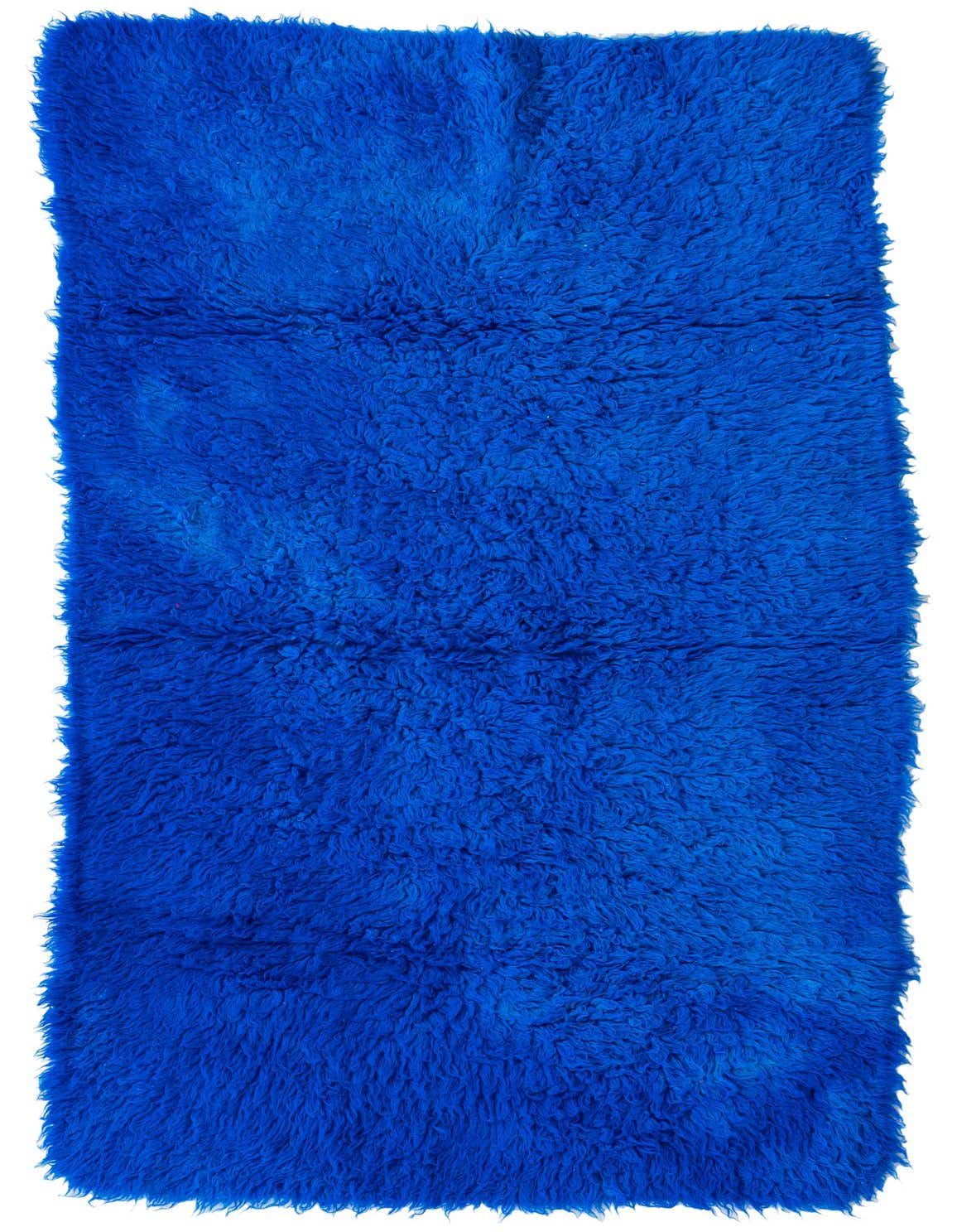 A vibrant 4x6 rectangular Moroccan shag rug in a rich blue hue, handmade from wool, perfect for a living room.