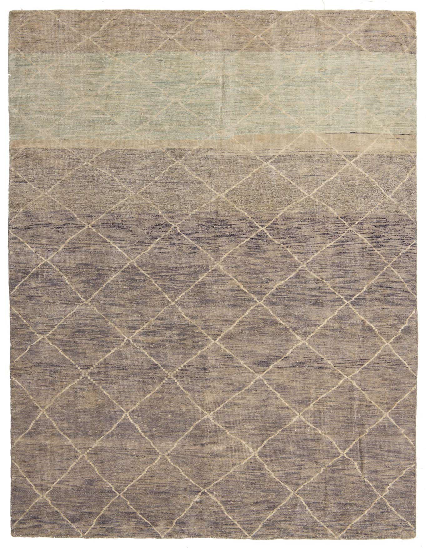 A 7x10 rectangular blue wool shag rug with a modern tribal diamond pattern and color block design.