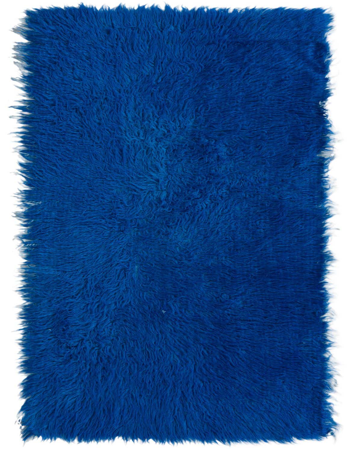 A vibrant 3x4 rectangular blue shag rug made of wool, featuring a plush, high pile texture.