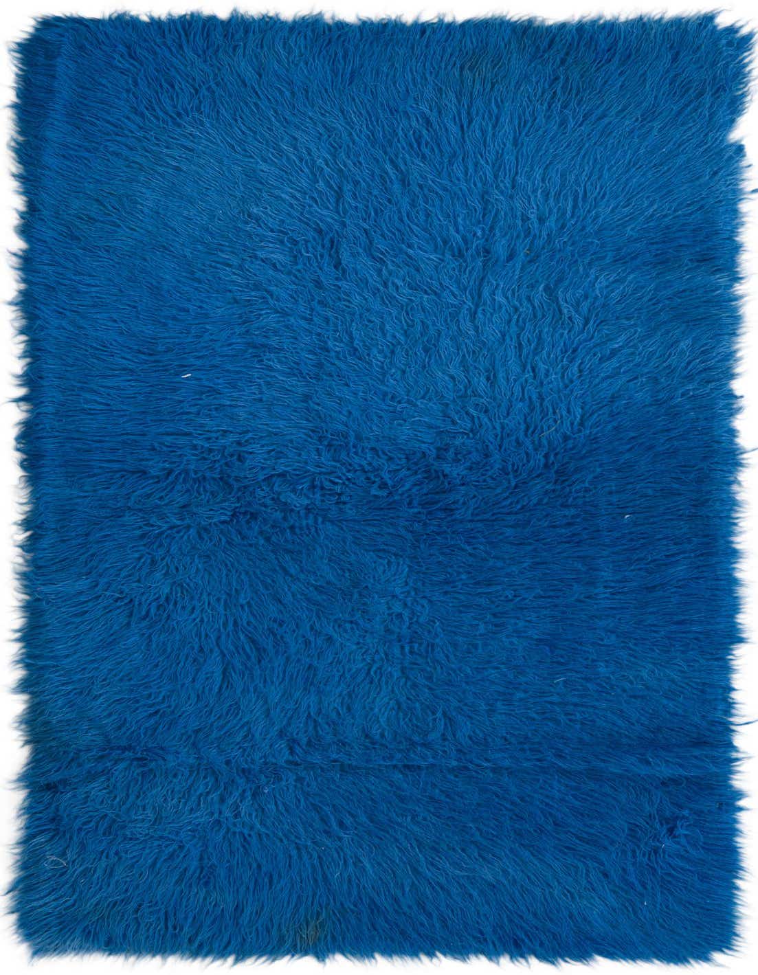 A vibrant 3x5 rectangular blue shag rug with a plush, high pile, showcasing its soft texture.