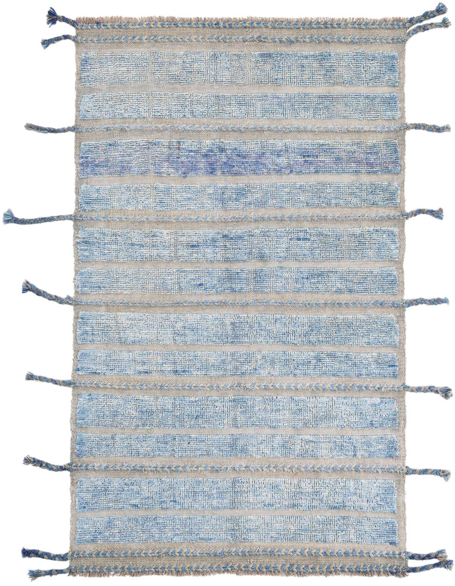 A 4x6 rectangular blue and beige wool shag rug with horizontal stripes and braided details, featuring tassels on the sides.