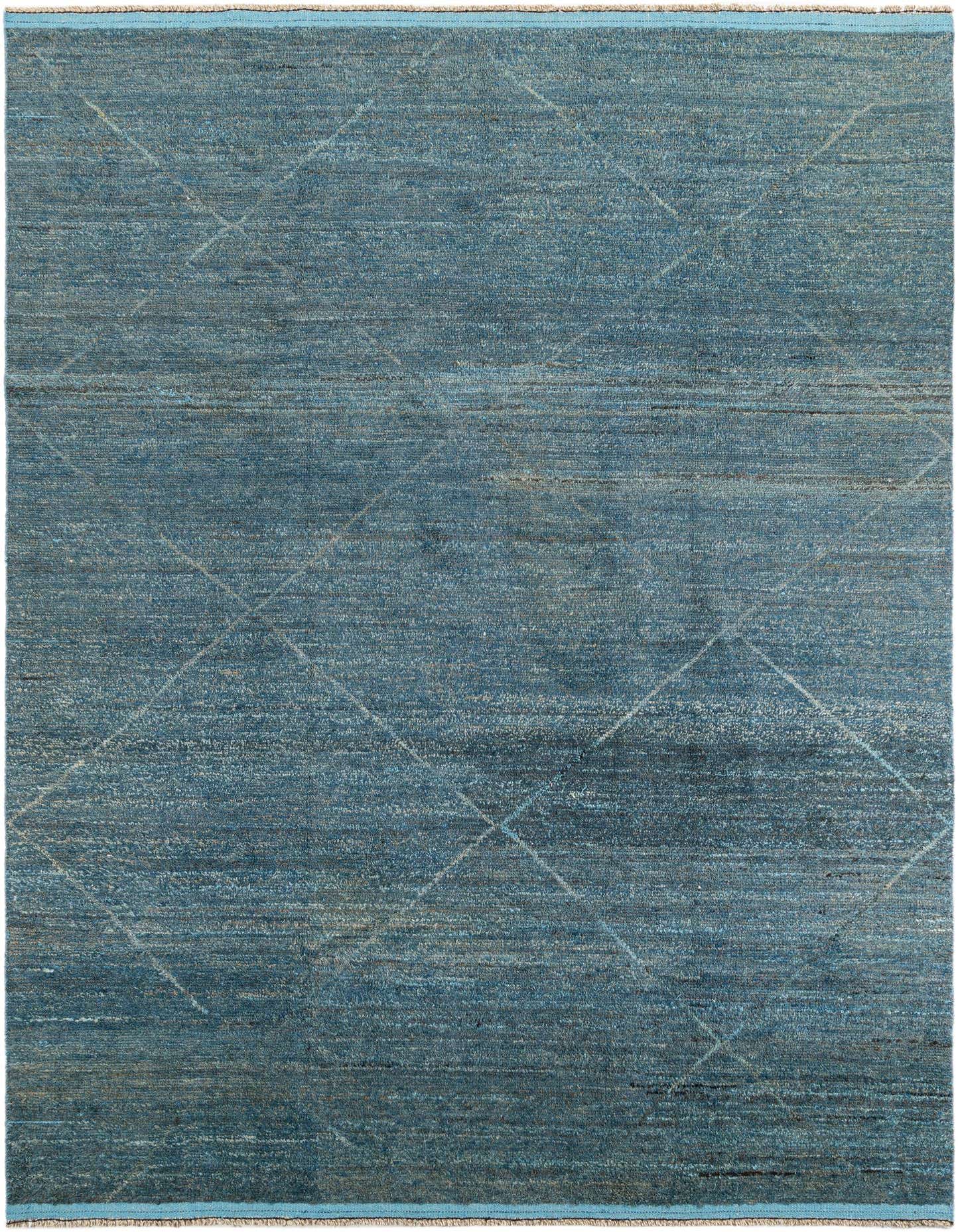 A 9x12 rectangular Moroccan shag rug in varying shades of blue with subtle tribal diamond patterns.