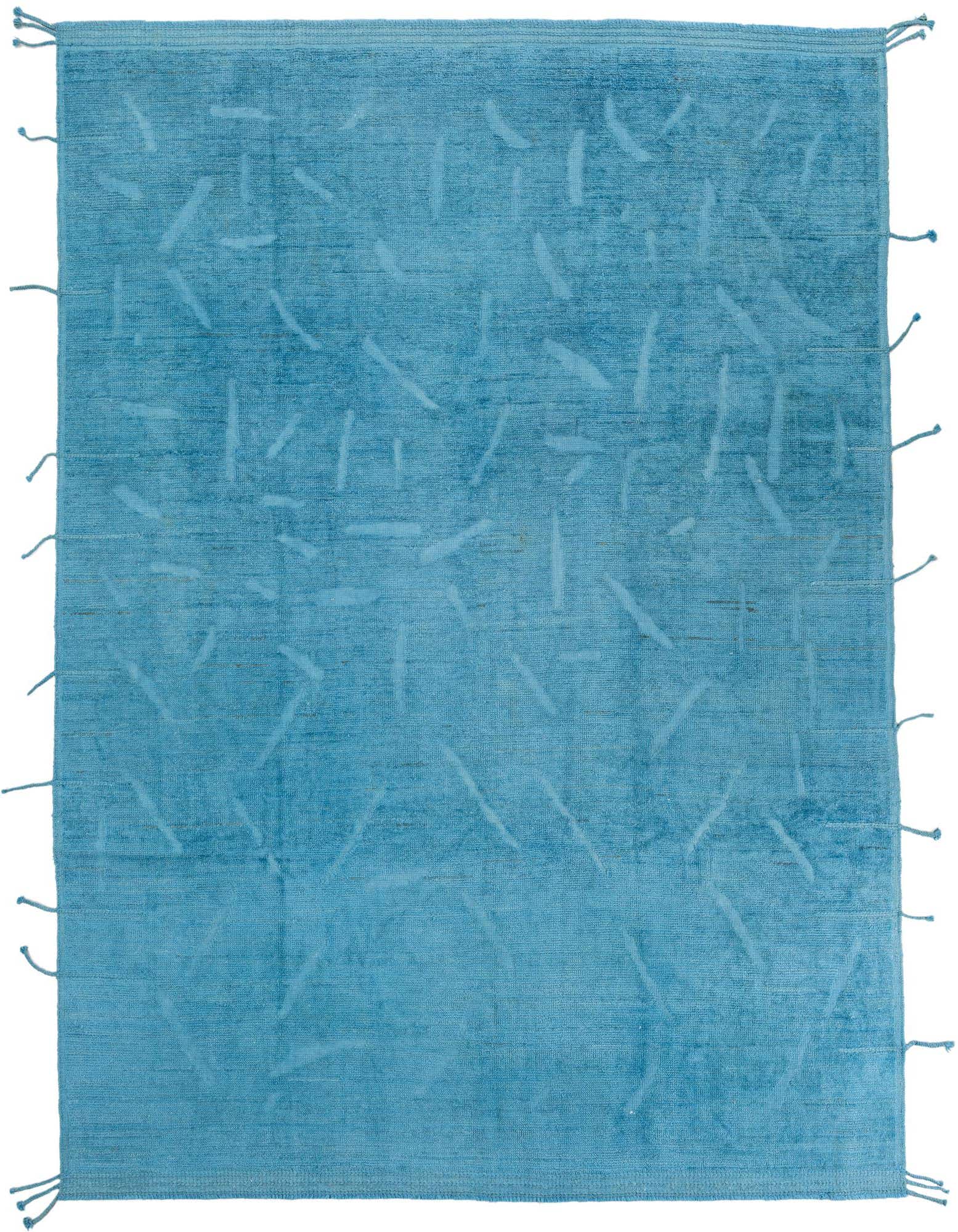 A 9x12 rectangular blue shag rug with a subtle abstract tribal pattern and fringe edges, suitable for a living room.