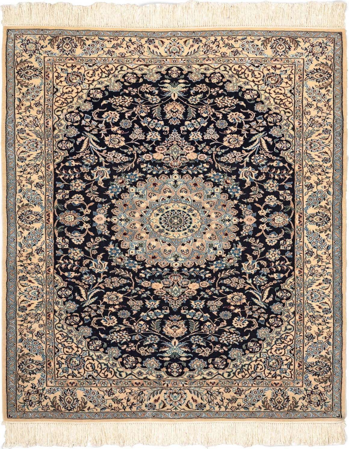 A 4x6 rectangular handmade Persian rug with a central medallion, featuring intricate floral patterns in shades of blue, cream, and beige on a dark blue background, with cream fringe.