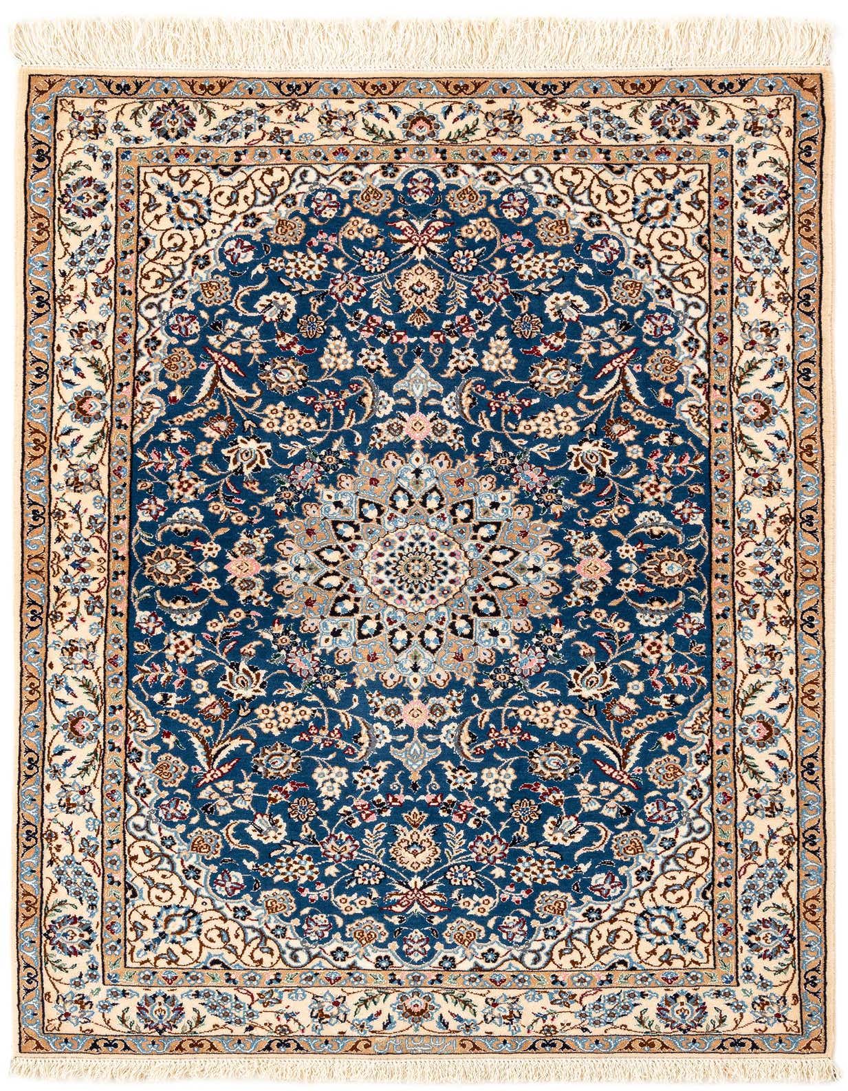 A rectangular handmade Persian rug with a deep blue field and intricate floral patterns, bordered by a cream frame.