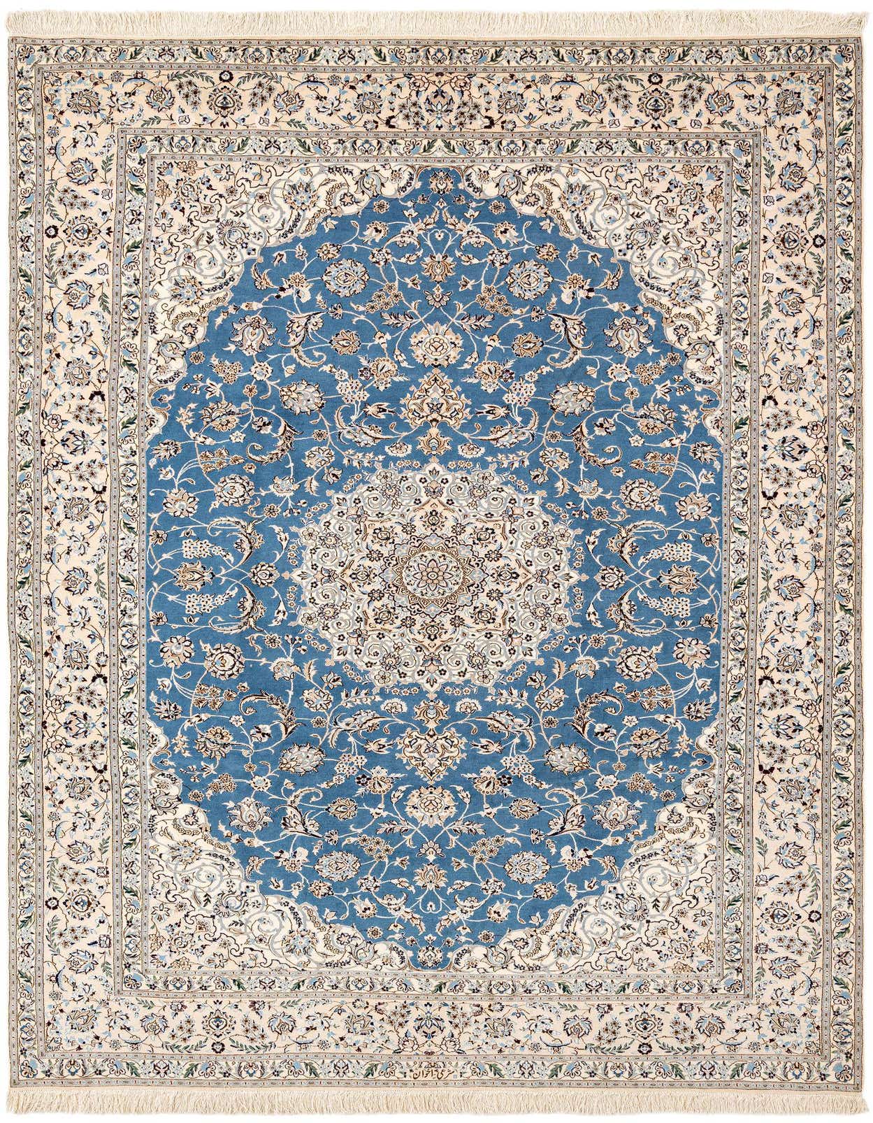 A rectangular handmade Persian rug featuring a central blue medallion with intricate floral patterns, bordered by a cream field and fringe.