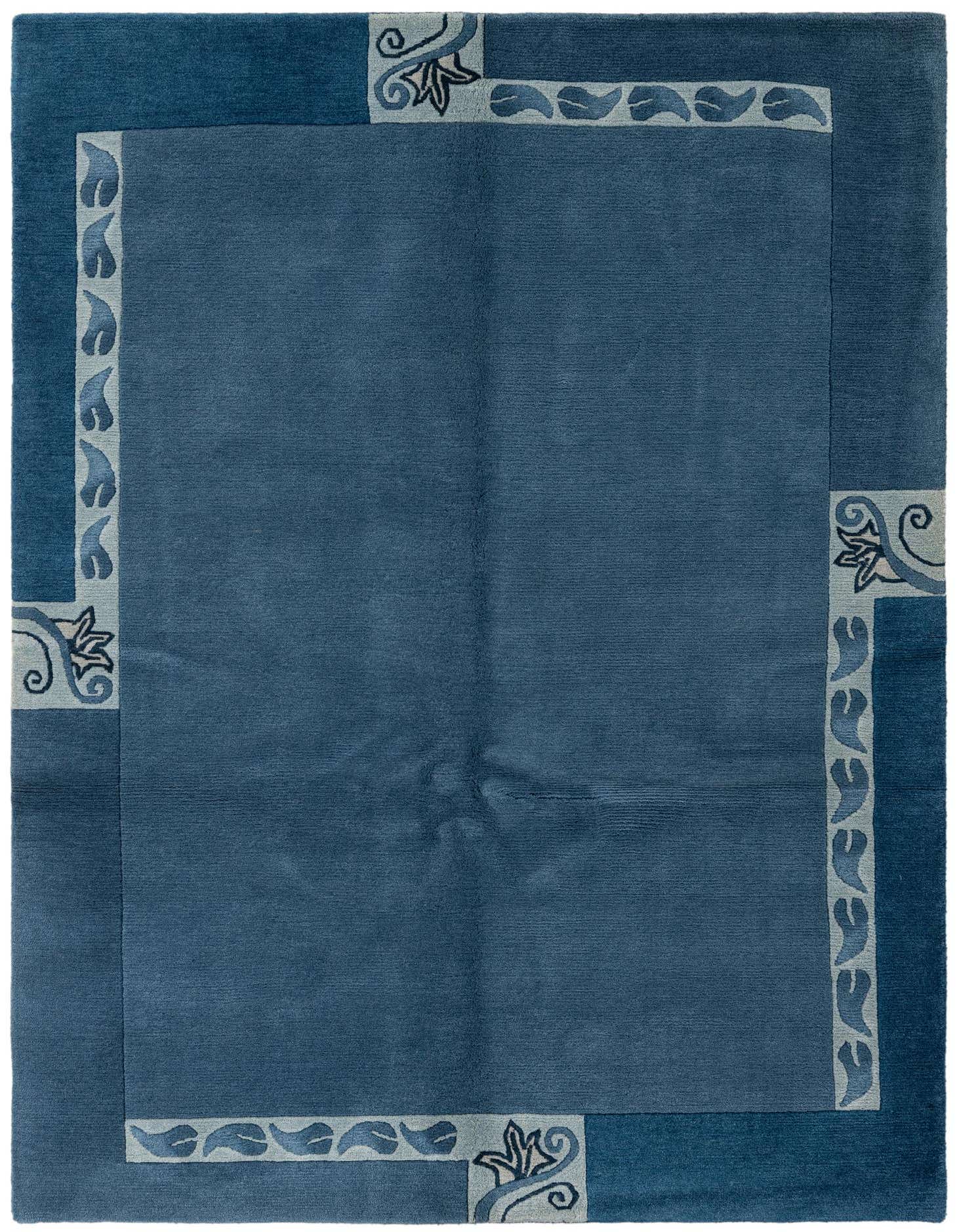 A 4x6 rectangular blue wool rug with a medium pile, featuring a modern floral border in lighter blue tones.