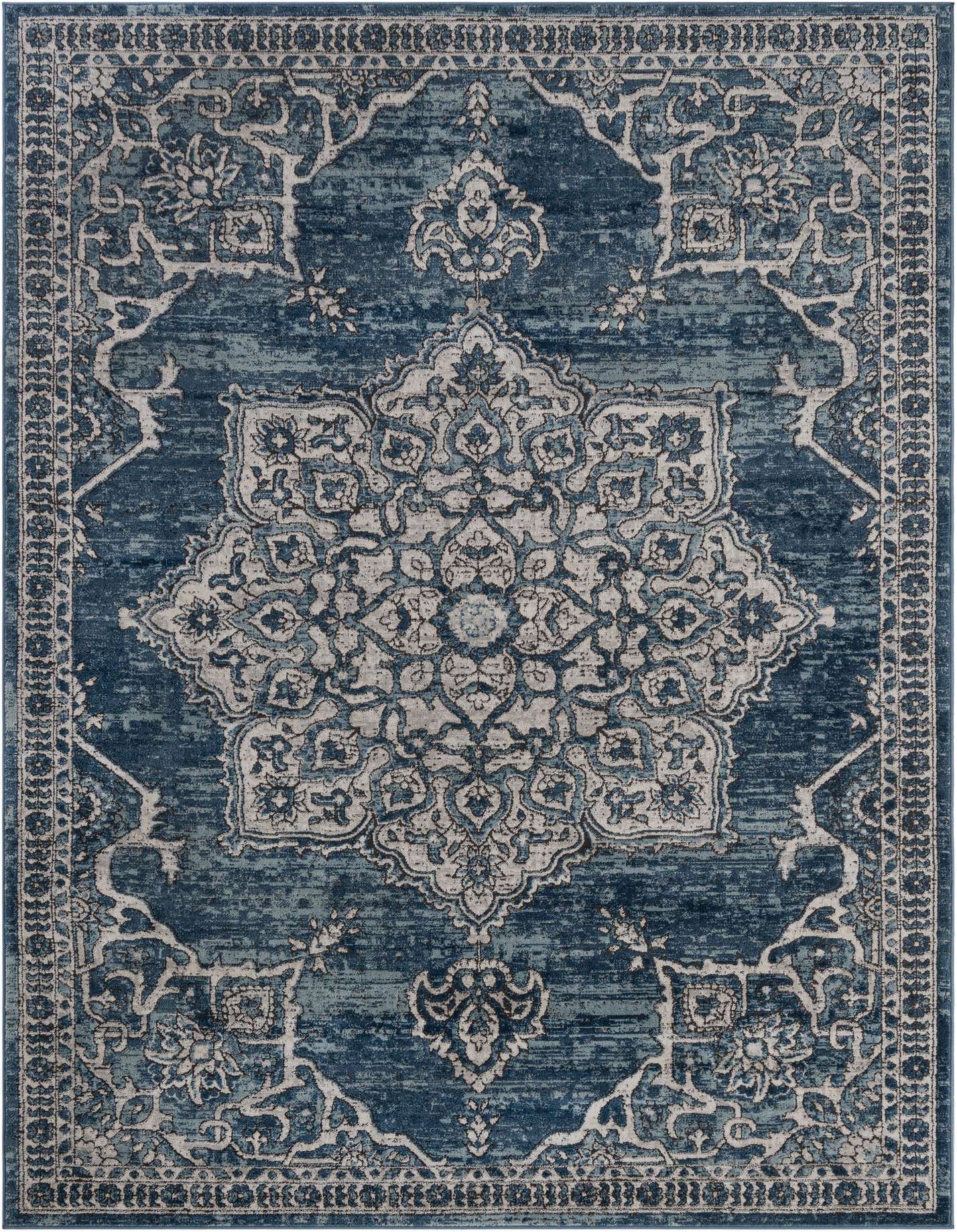 A 7x10 rectangular Nyla rug in varying shades of blue, featuring a distressed traditional medallion and oriental pattern.