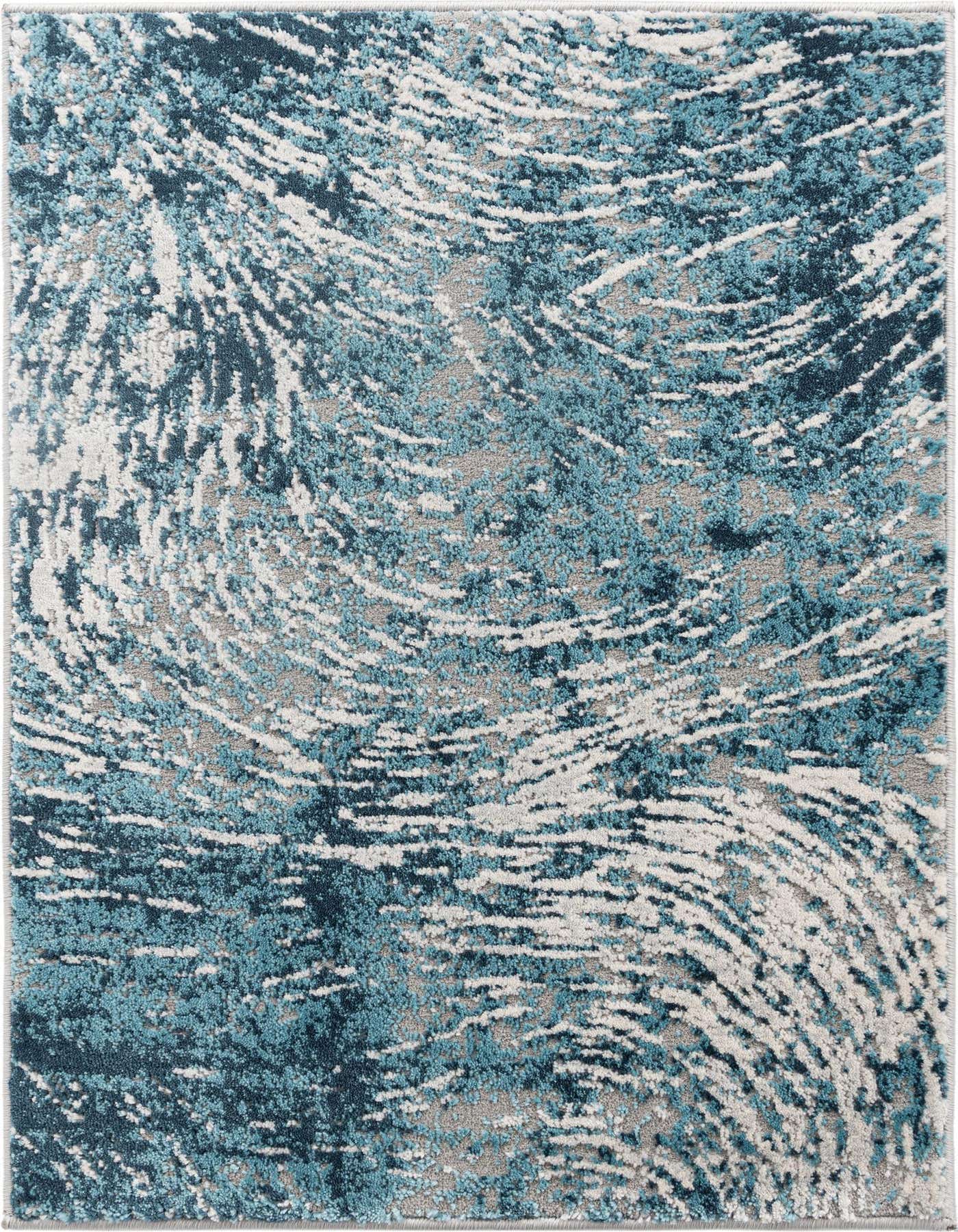 A 2x3 rectangular indoor rug featuring an abstract coastal pattern in varying shades of blue, white, and gray.