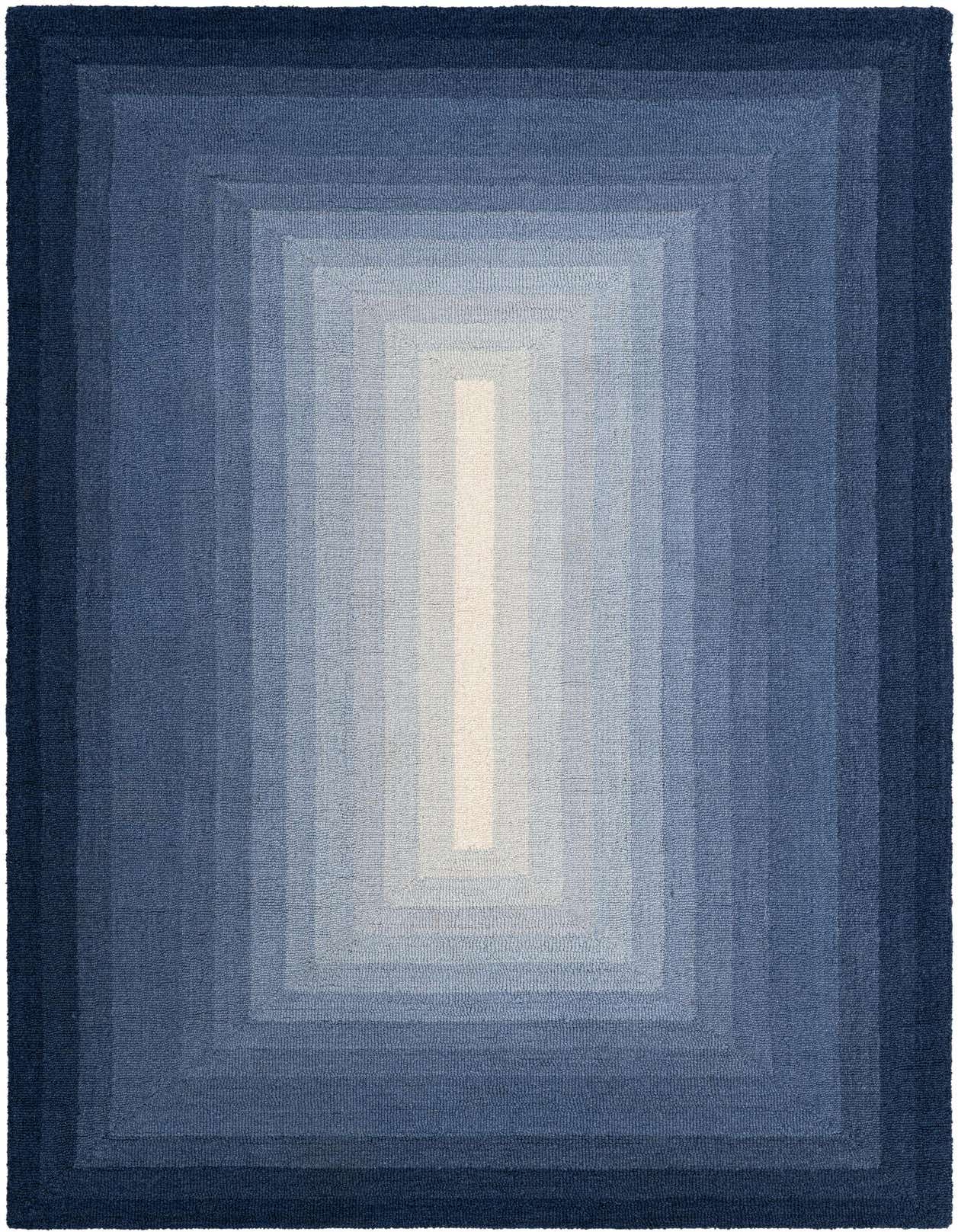 A 5x8 rectangular Ombre Wool rug featuring a modern gradient of blues, from dark navy to light sky blue, with a bright white center.