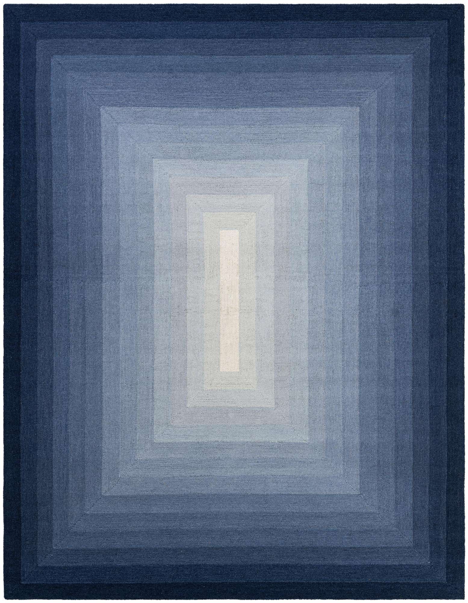 A rectangular 8x10 blue wool rug featuring an ombre effect, transitioning from dark navy blue edges to a light blue center.