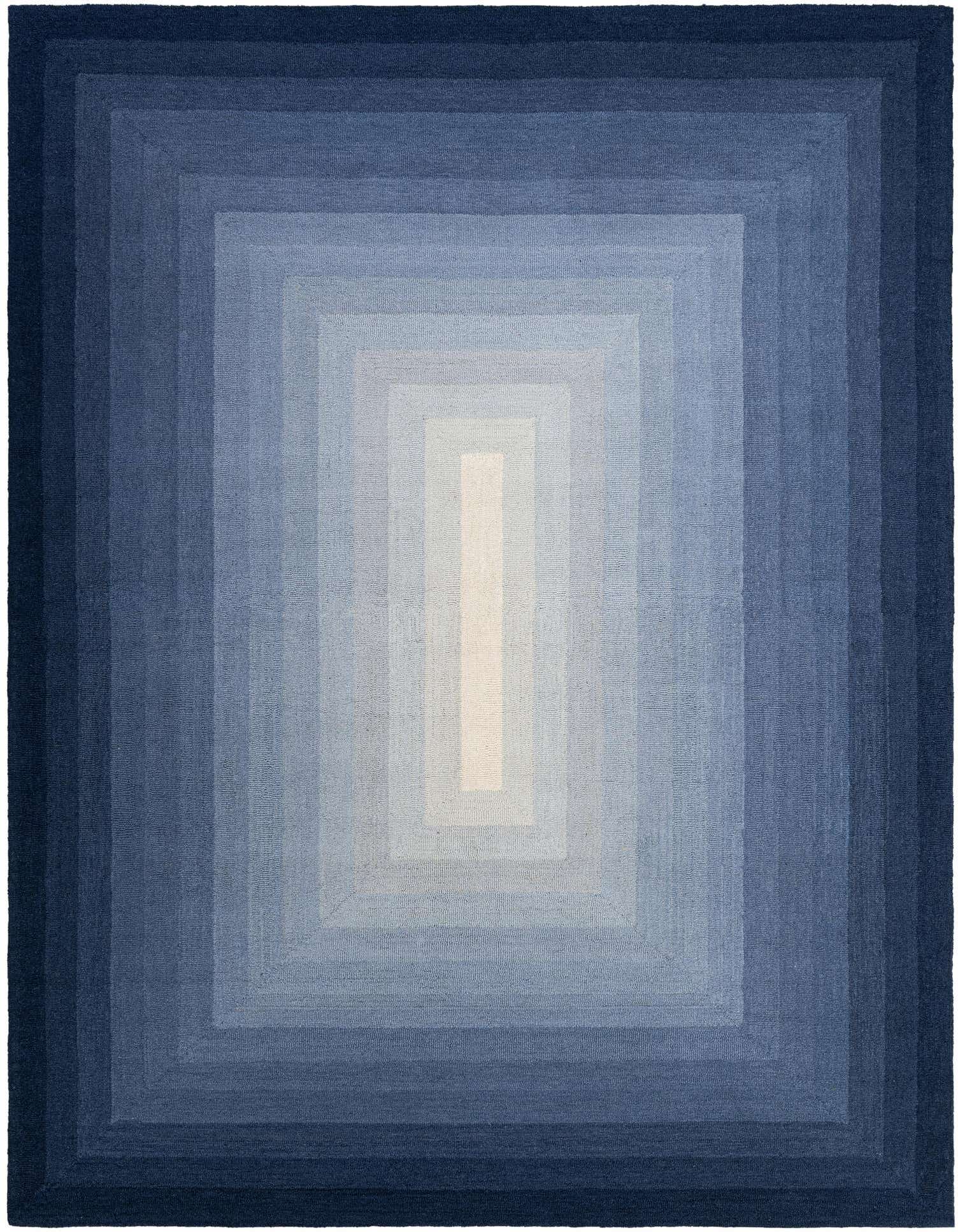 A 9x12 rectangular Ombre Wool rug featuring a gradient of blues, from dark navy at the edges to a light blue and off-white center.