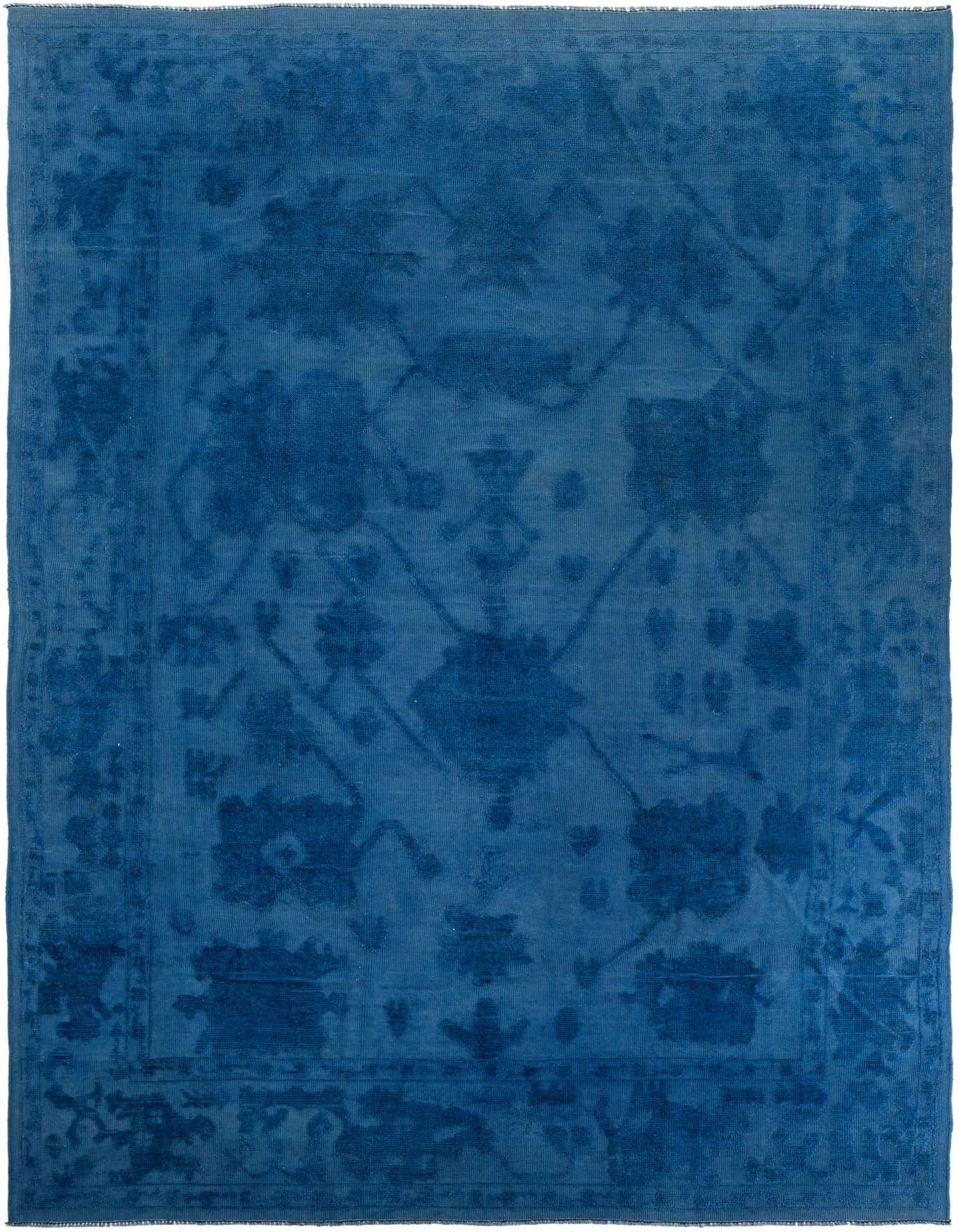 A large 10x14 rectangular Oushak rug in varying shades of deep blue with a subtle modern floral pattern.